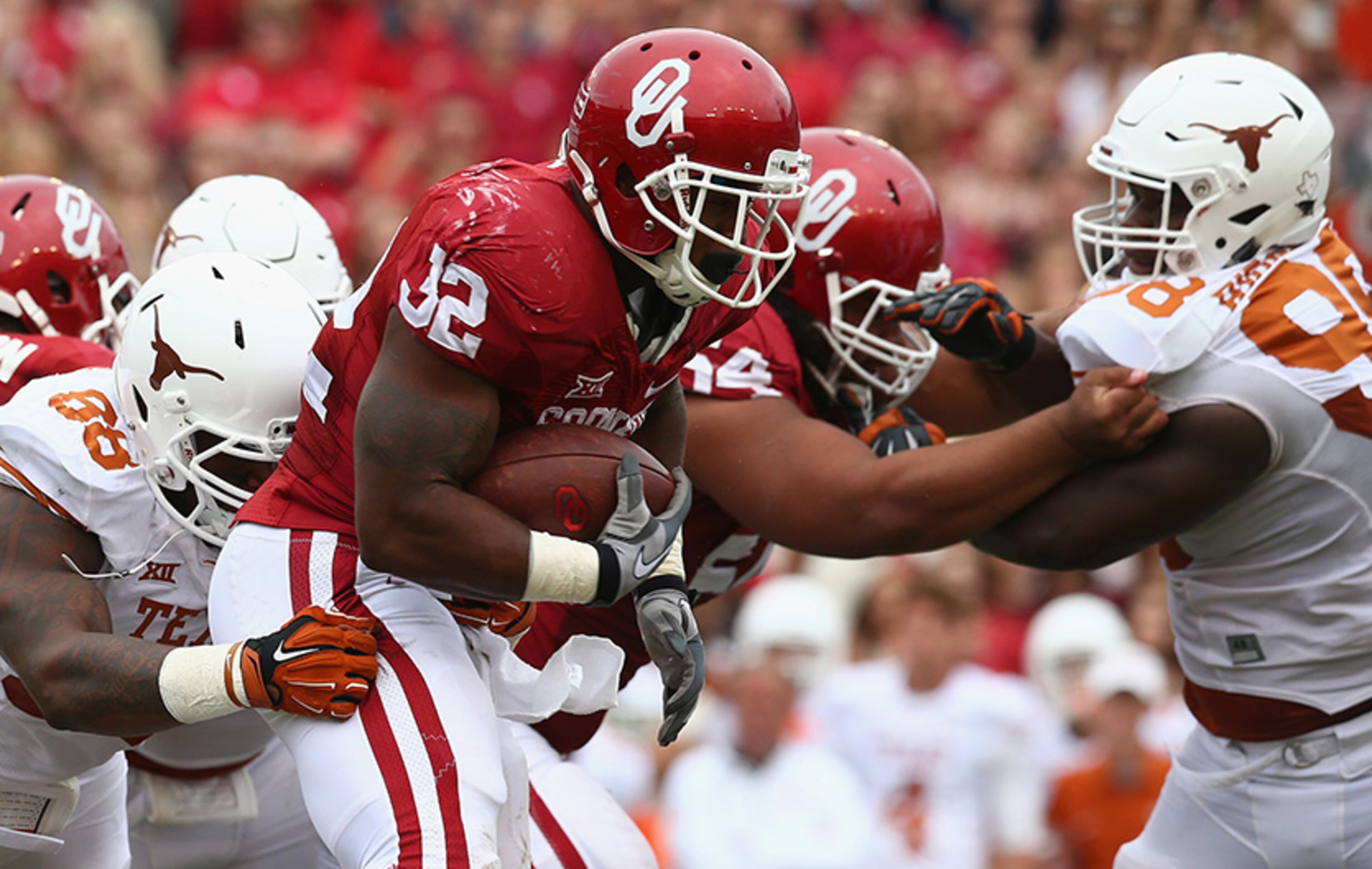 Oklahoma-Texas: Since 1912, the Sooners and Longhorns have played all but three of their games in Dallas -- halfway between Austin, Texas, and Norman, Okla. And since 1932, the Cotton Bowl has been the site and the game has been played during the Texas State Fair. Corny dogs and Ferris wheels are as much a part of the Red River Rivalry as great football by two perennial powerhouses.