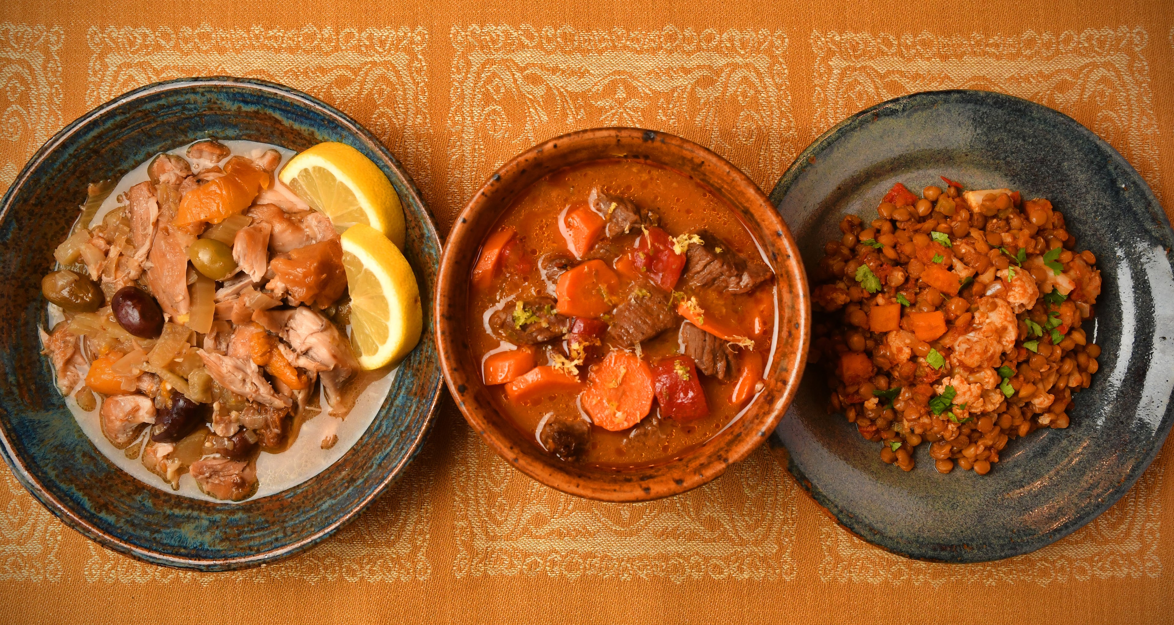 These recipes exemplify the three ways stews can be prepared: (from left) Chicken Stew with Dried Fruit and Olives, Lemon-Lime Beef and Carrot Stew and Slow Cooker Lentil Stew with Cauliflower. (Styling by Cynthia Graubart/Chris Hunt for the AJC)