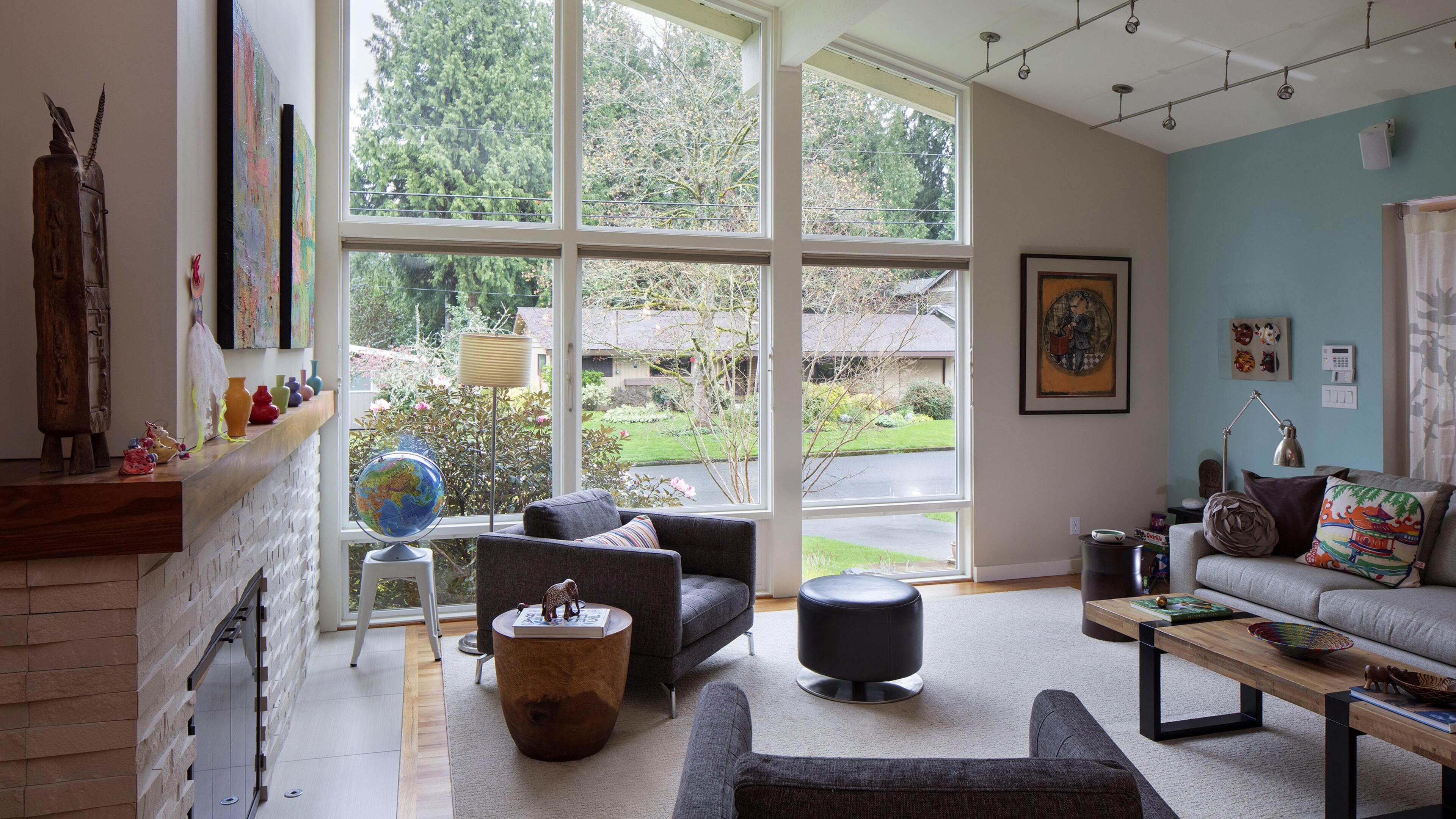 The Weisses moved walls and remodeled the fireplace in their living area, while adding a new couch and footstool from Seldens Home Furnishings and three bright pieces of Etsy art to the Kasala gray chairs they already had. “I love color,” Ellen Weiss says. “Here it’s a neutral background with a lot of pops of cheerful color.” (Steve Ringman/Seattle Times/TNS)