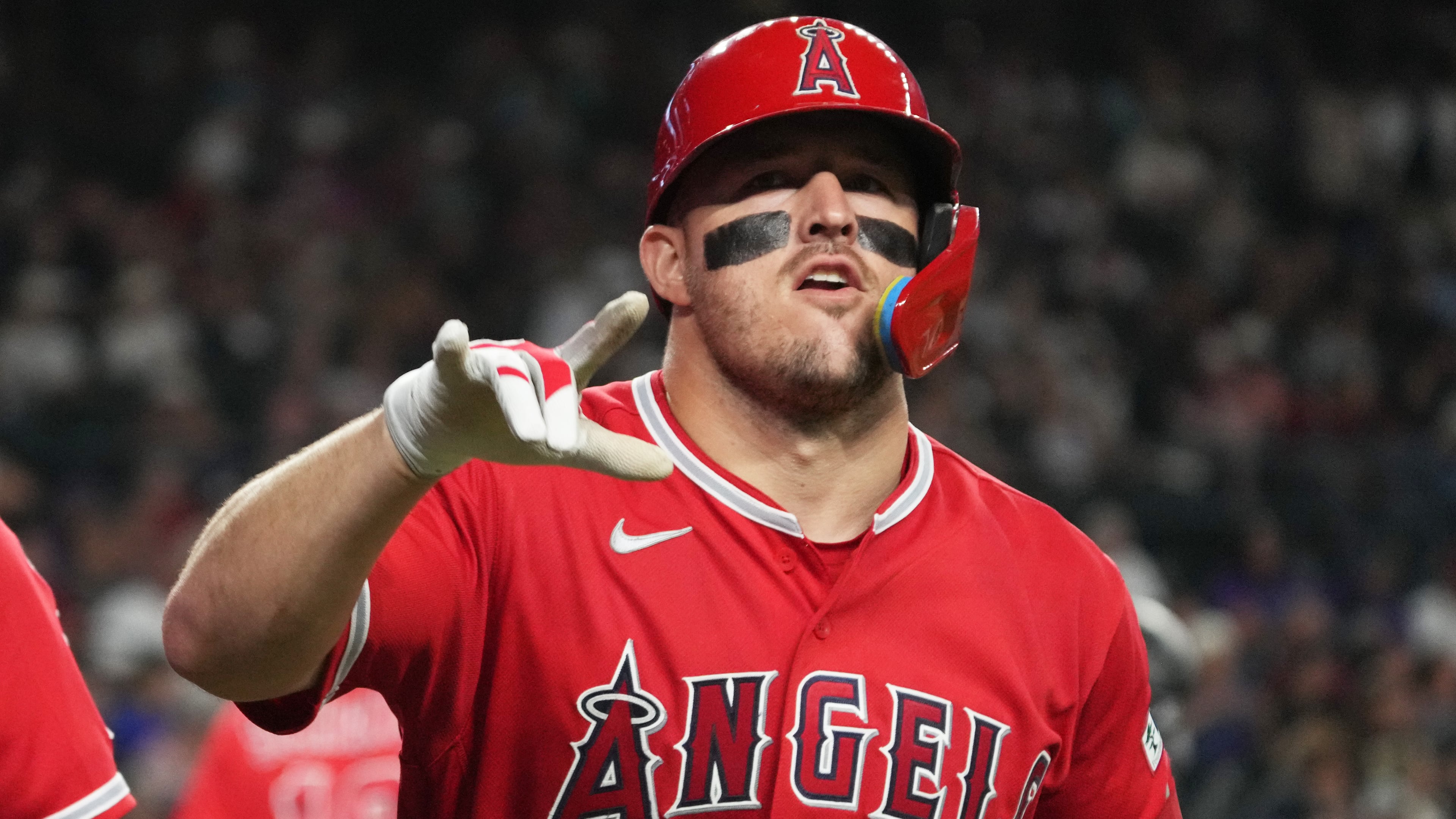 Los Angeles Angels' Mike Trout (27) reacts after hitting a two-run home run against the Arizona Diamondbacks in the fifth inning of a baseball game, Tuesday, June 16, 2026, in Phoenix. (AP Photo/Rick Scuteri)