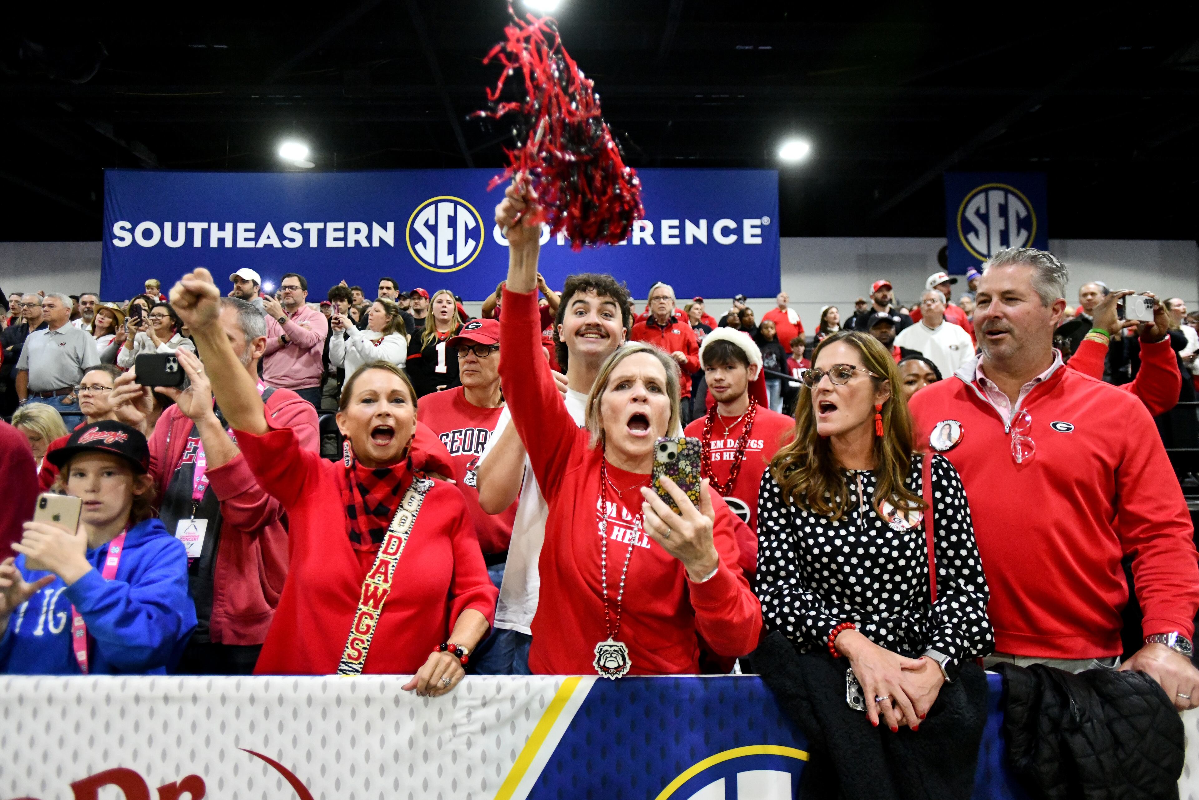 Georgia fans cheer during pep rallies at The Dr Pepper SEC FanFare ahead of the SEC Championship football game between Georgia and Alabama, Saturday, Dec. 6, 2025 in Atlanta. (Hyosub Shin/AJC)