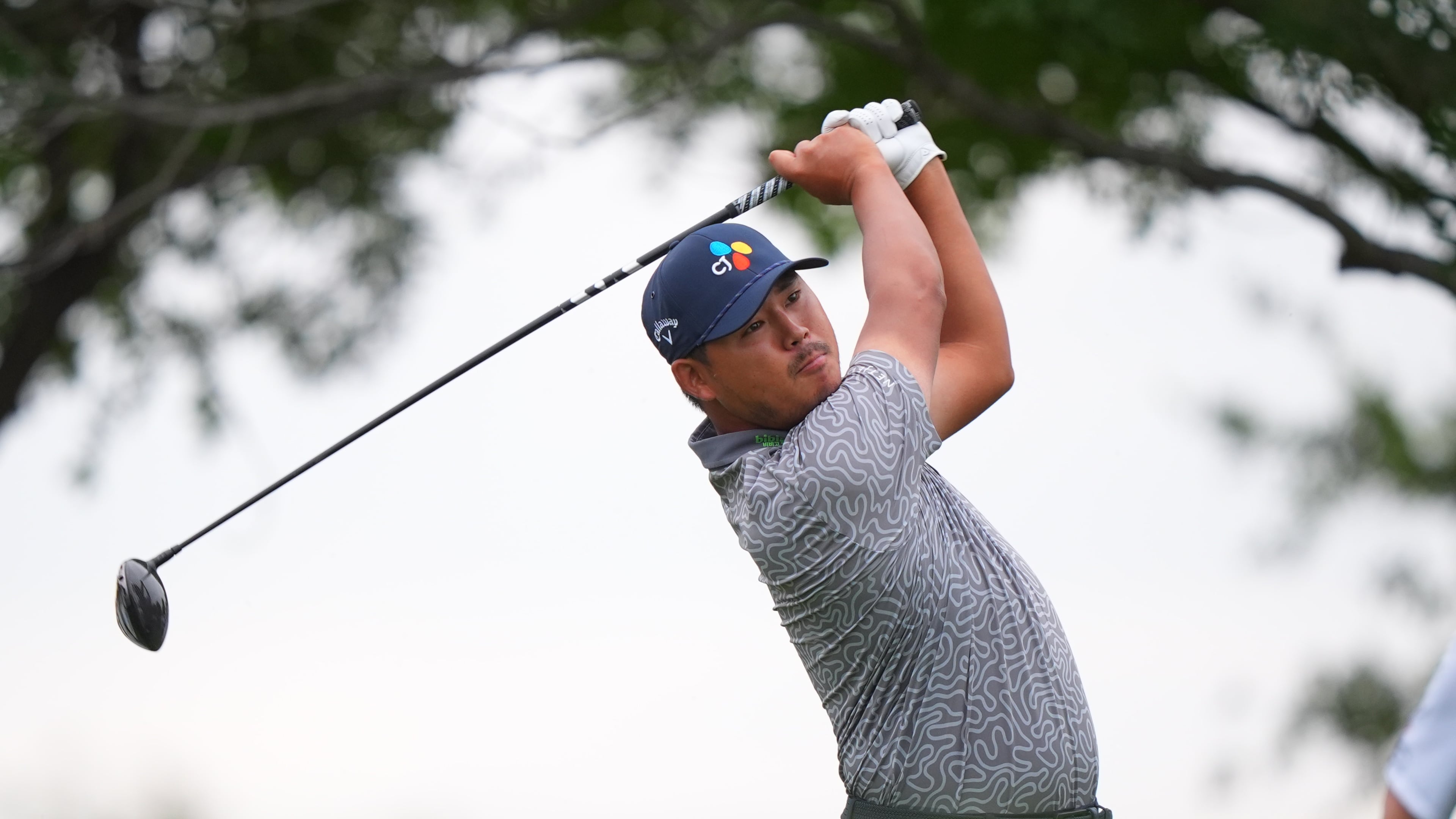 Si Woo Kim, of South Korea, watches his tee shot on the 11th hole during the first round of the Byron Nelson golf tournament in McKinney, Texas, Thursday, May 21, 2026. (AP Photo/LM Otero)