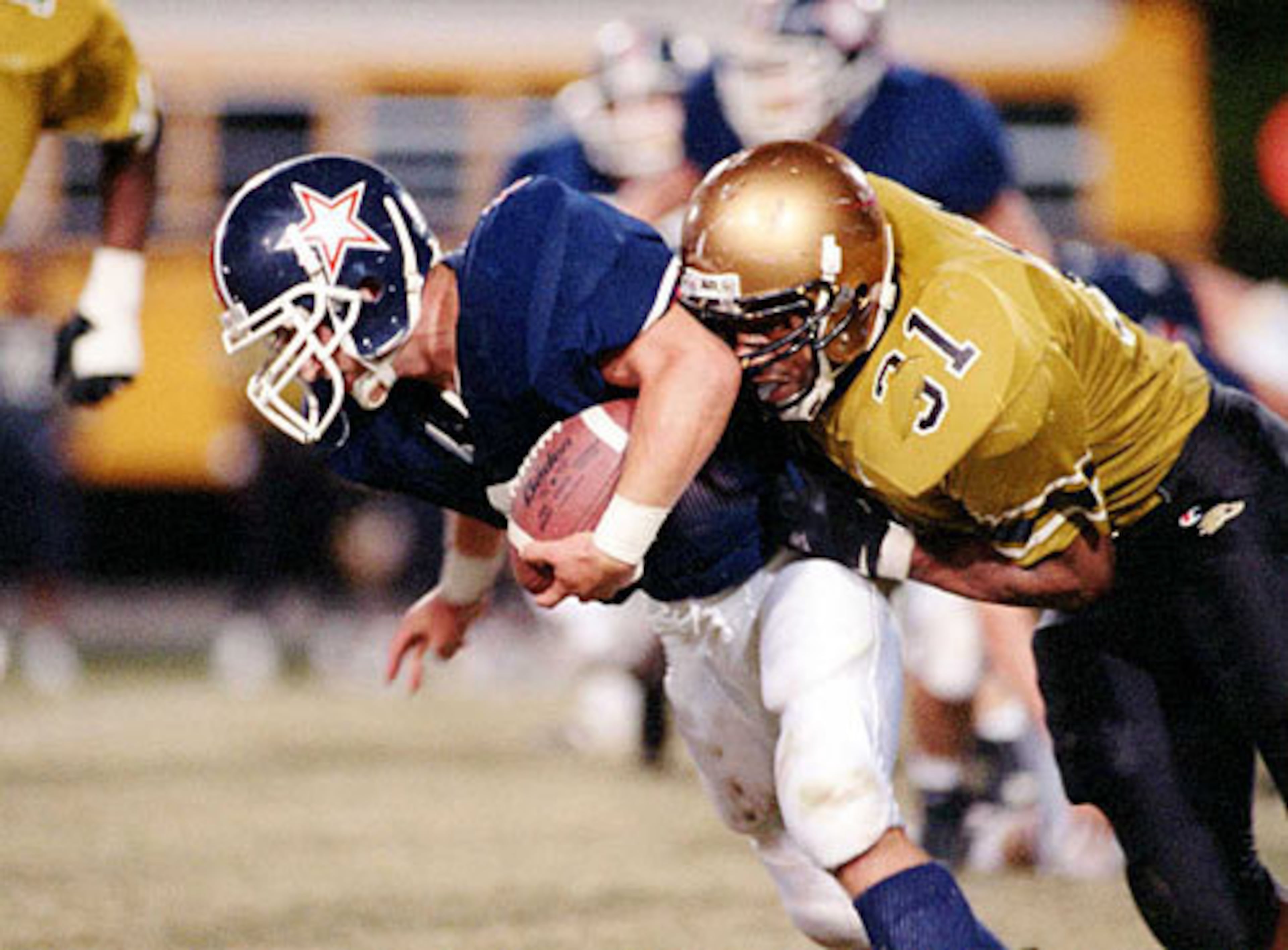 Lewis (31, right, vs. Dunwoody in 1995) gained 1,923 yards and scored 28 TDs as a junior.
