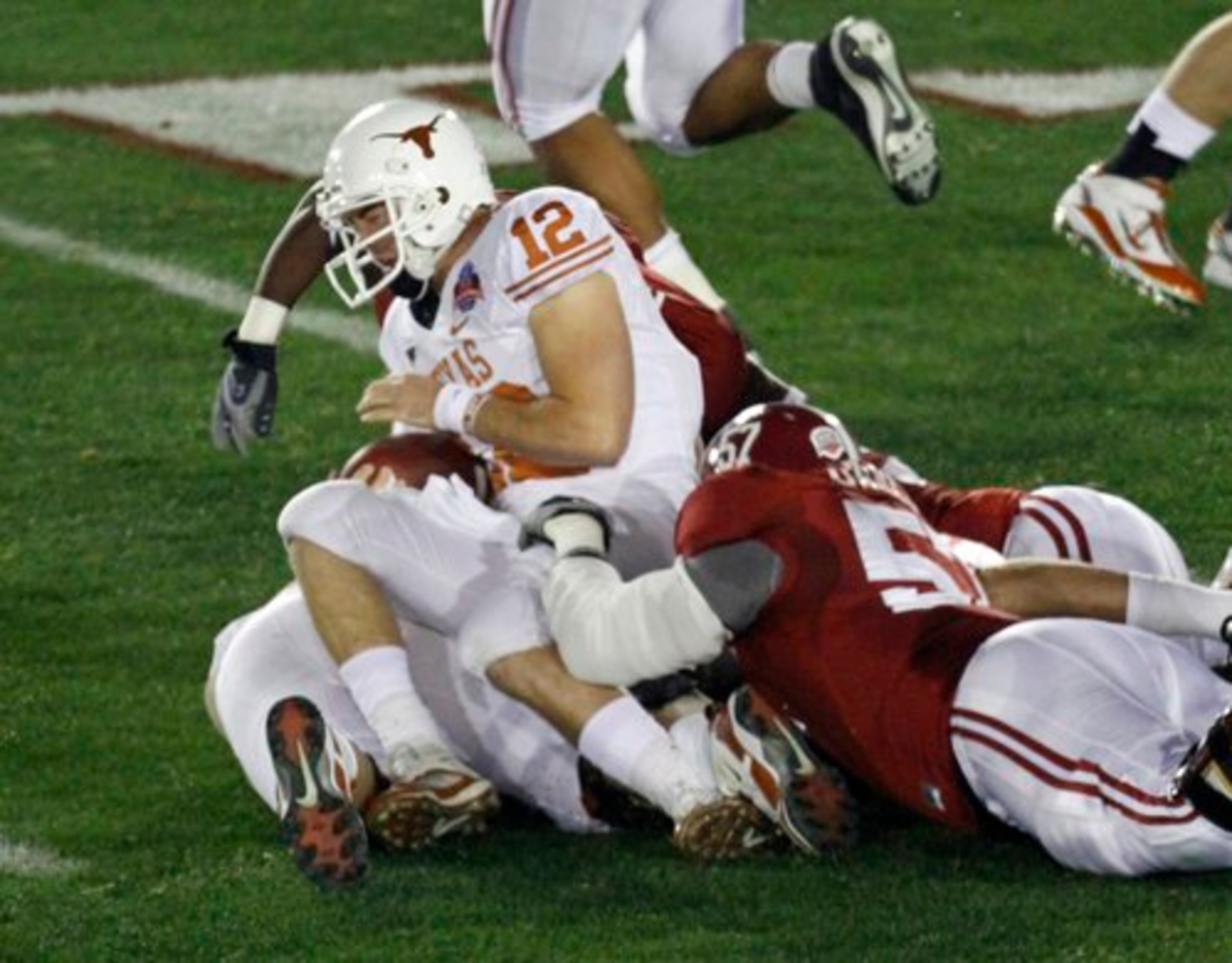 McCoy is tackled by Alabama defenders during the first quarter.