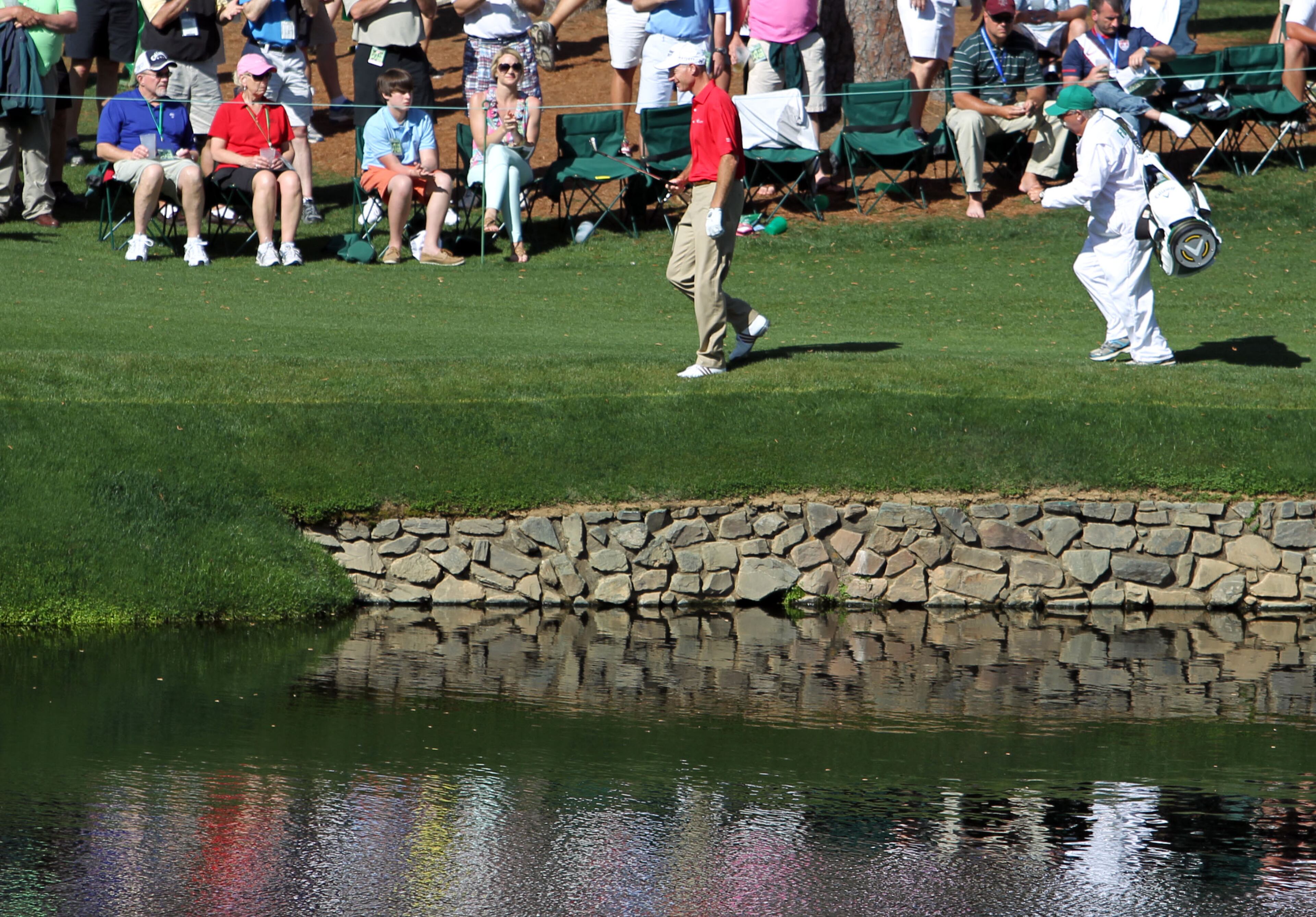 Jim Furyk walks by the pond on #15 during the second round in the Masters Tournament on Friday April 12 2013. He double bogeyed the Par 5 hole after hitting in to the water. JASON GETZ / JGETZ@AJC.COM
