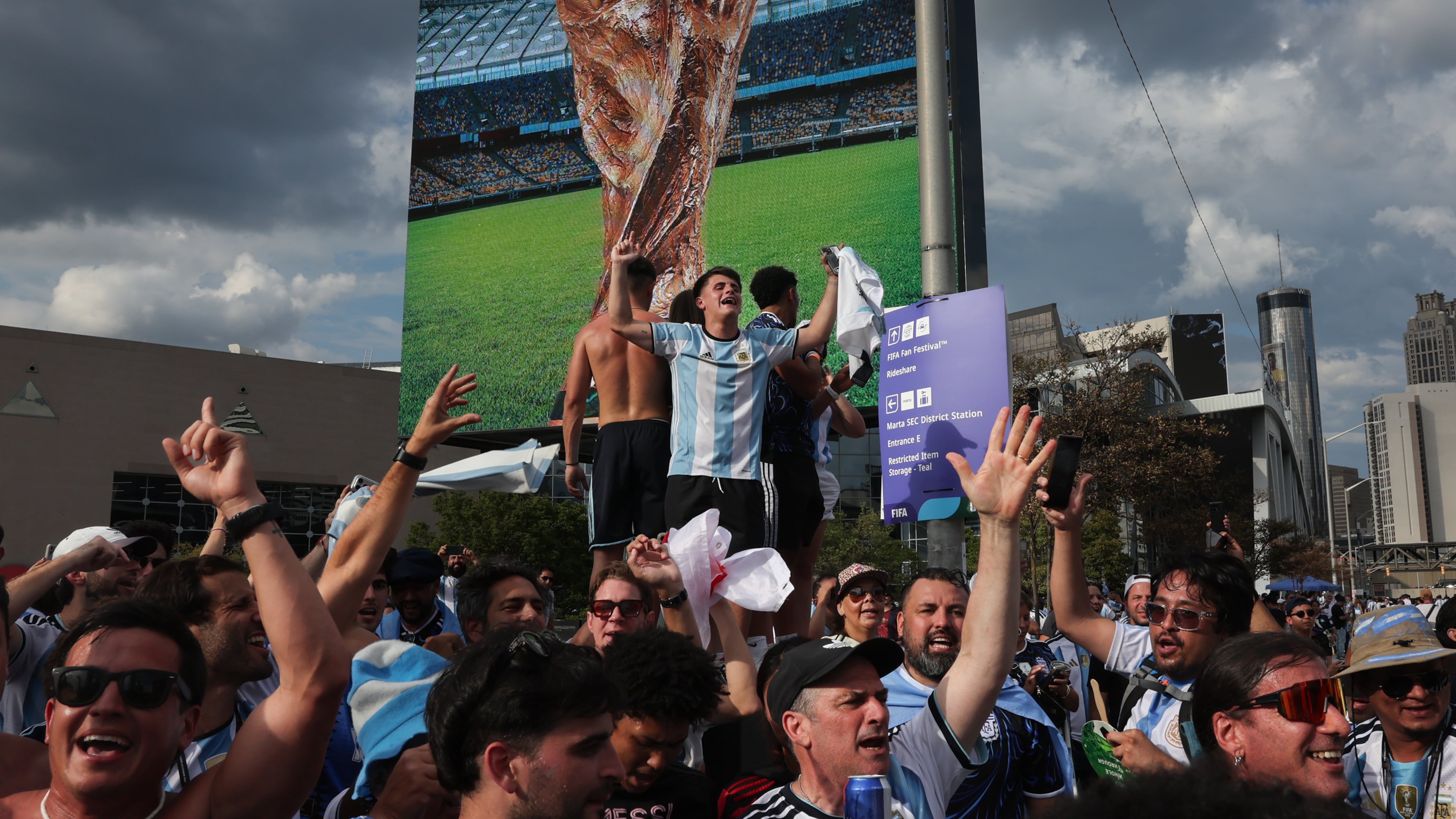 Argentina fans celebrate outside Atlanta Stadium (Mercedes-Benz Stadium) after Argentina wins the FIFA World Cup game against England on July 15, 2026. (Arvin Temkar/AJC)