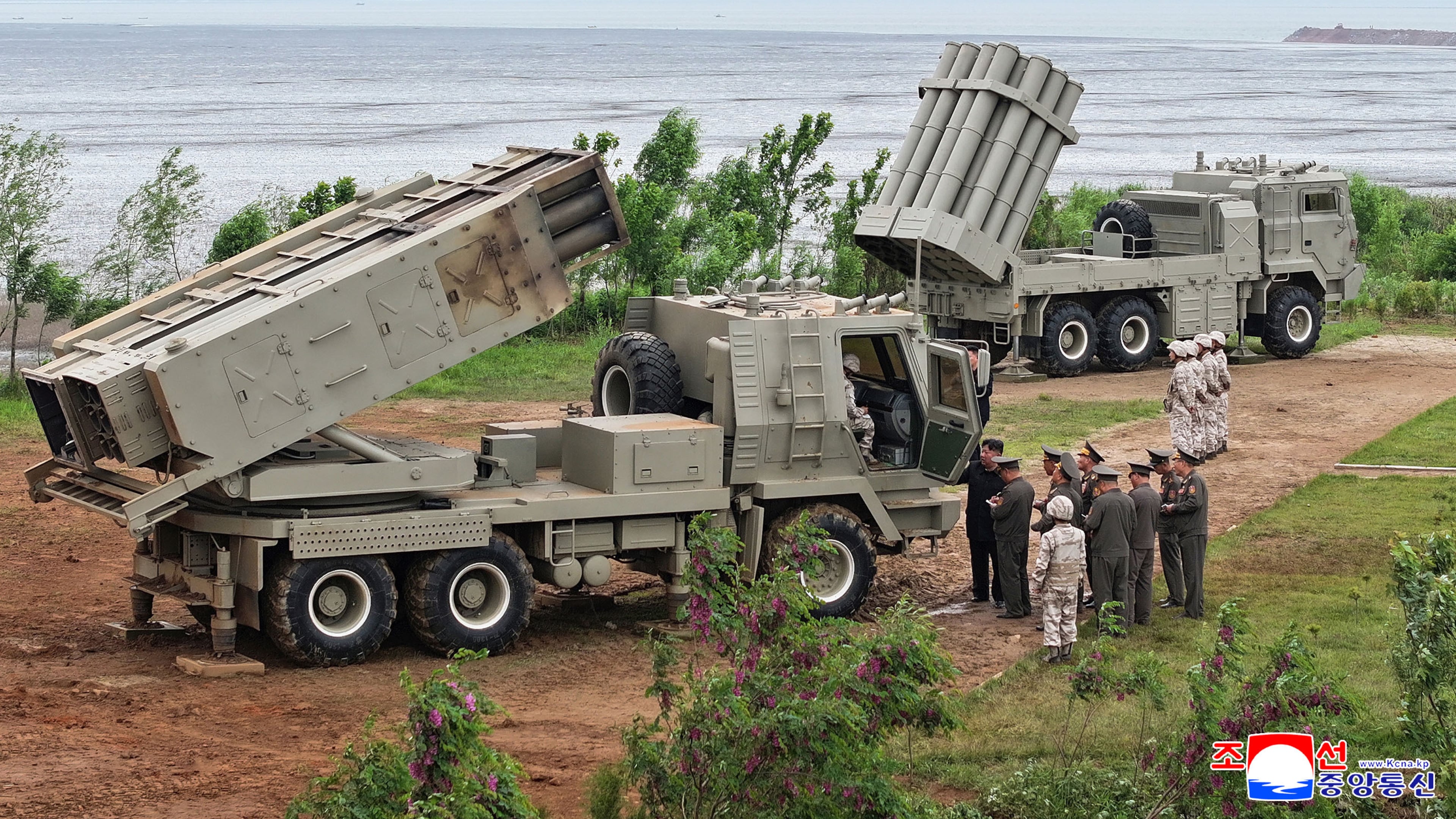 In this photo provided by the North Korean government, its leader Kim Jong Un, center right, inspects the multiple weapons systems, at an undisclosed location, North Korea, Tuesday, May 26, 2026. Independent journalists were not given access to cover the event depicted in this image distributed by the North Korean government. The content of this image is as provided and cannot be independently verified. Korean language watermark on image as provided by source reads: "KCNA" which is the abbreviation for Korean Central News Agency. (Korean Central News Agency/Korea News Service via AP)
