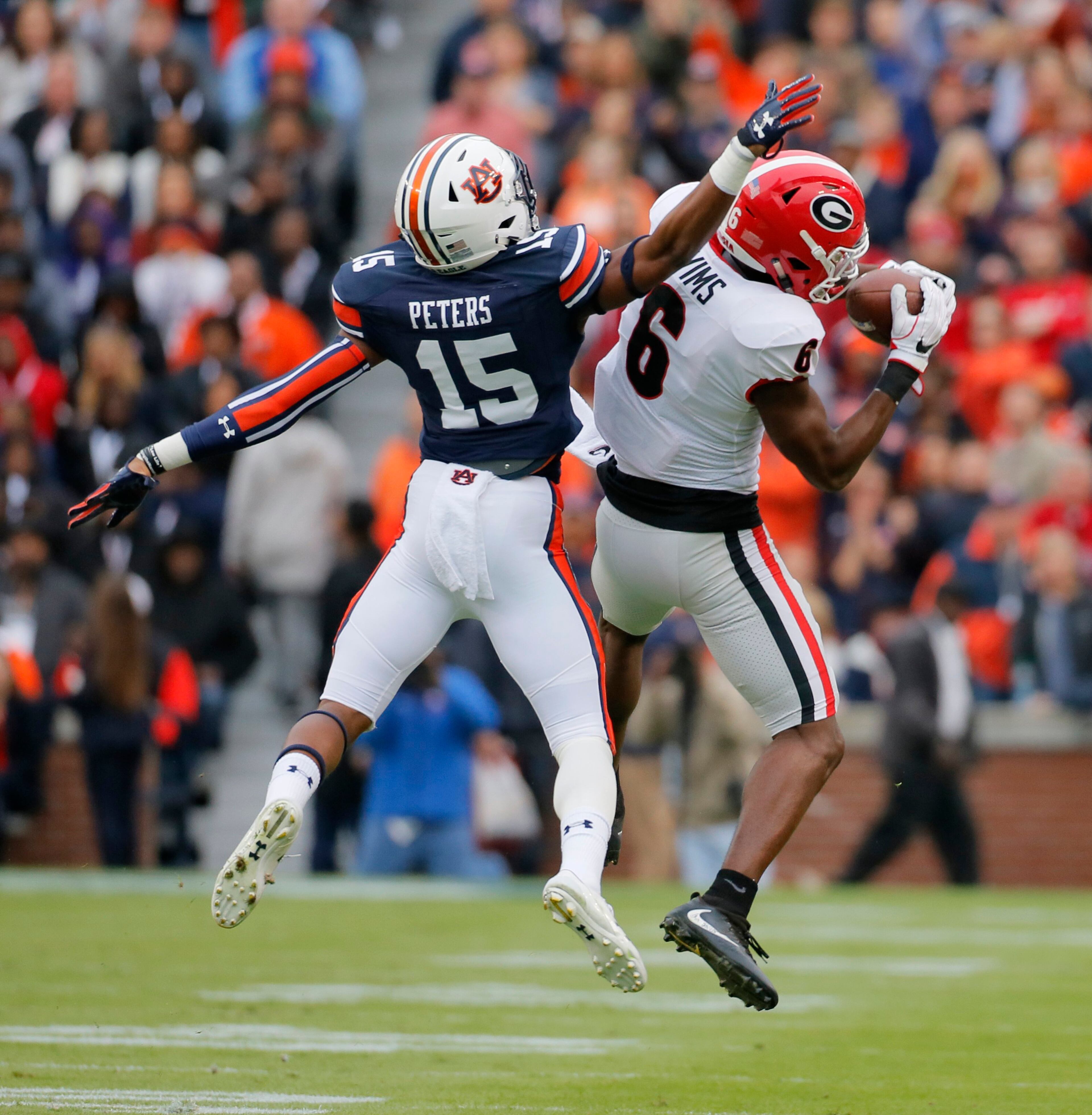 11/11/17 - Auburn - Georgia Bulldogs wide receiver Javon Wims (6) pulls in a long 1st qtr. pass to set up UGA's lone TD over Auburn Tigers defensive back Jordyn Peters (15). UGA plays Auburn in a NCAA college football game at Auburn BOB ANDRES /BANDRES@AJC.COM