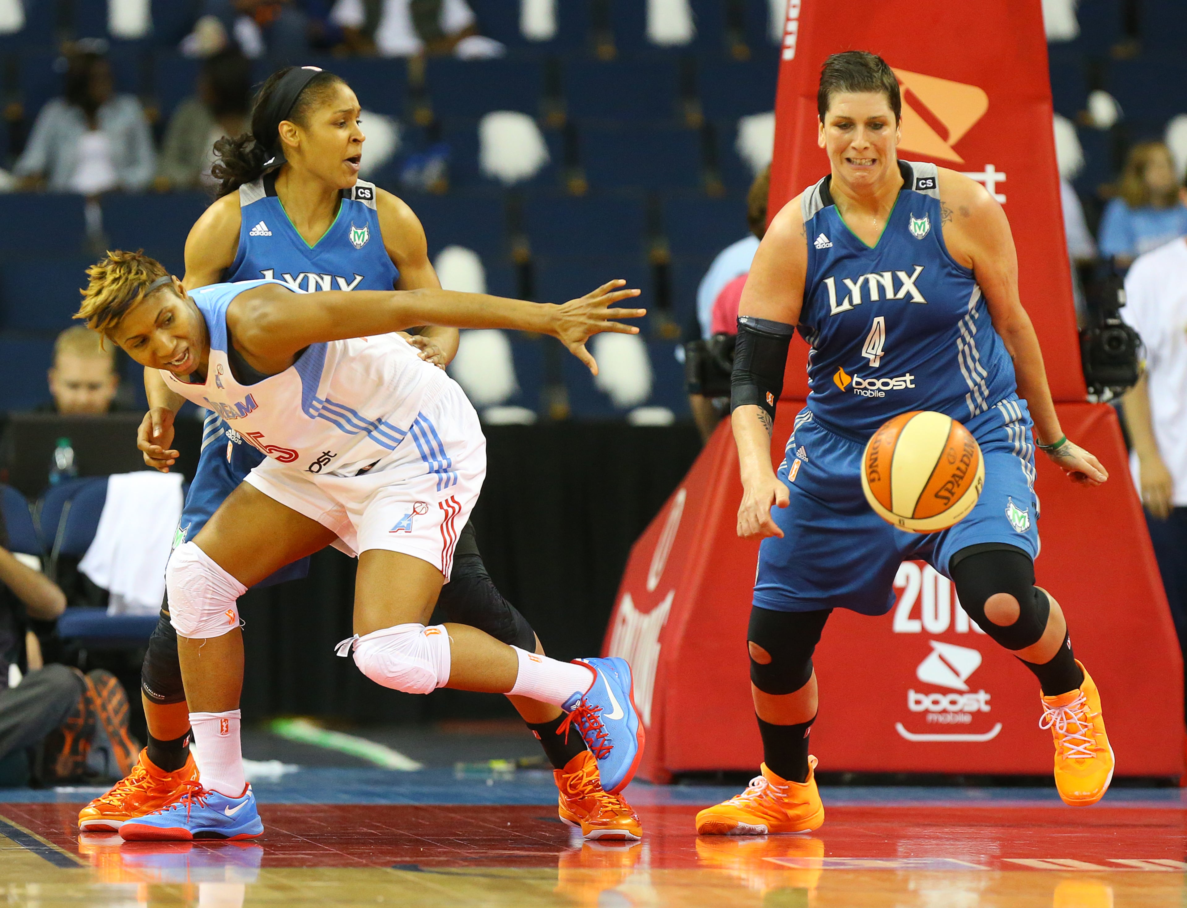Dream forward Tiffany Hayes turns the ball over to Lynx forward Janel McCarville during the second half of the WNBA Championship on Thursday, Oct. 10, 2013, in Duluth.