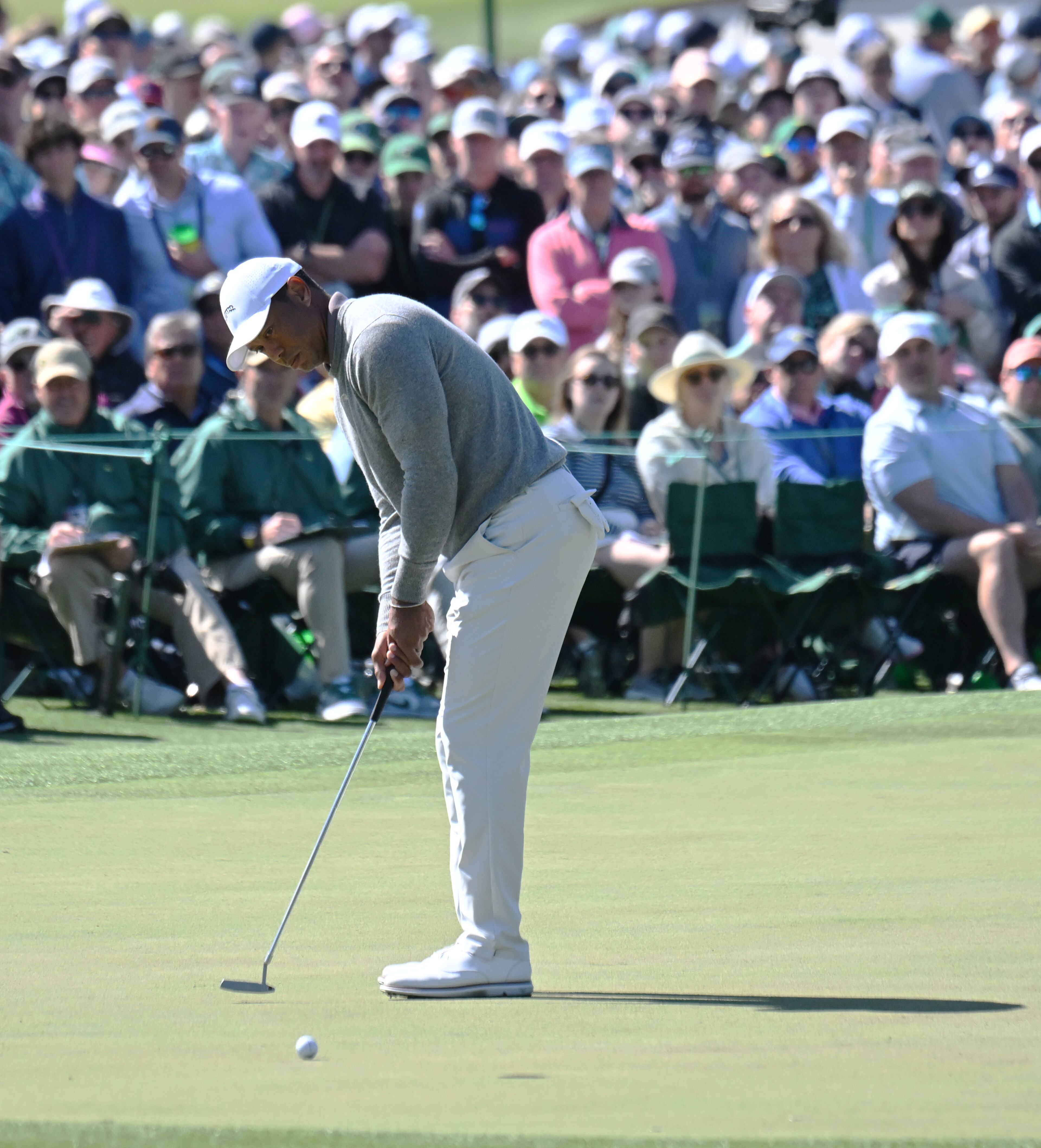 Tiger Woods putts on second green during second round of the 2024 Masters Tournament at Augusta National Golf Club, Friday, April 12, 2024, in Augusta, Ga. (Hyosub Shin / Hyosub.Shin@ajc.com)