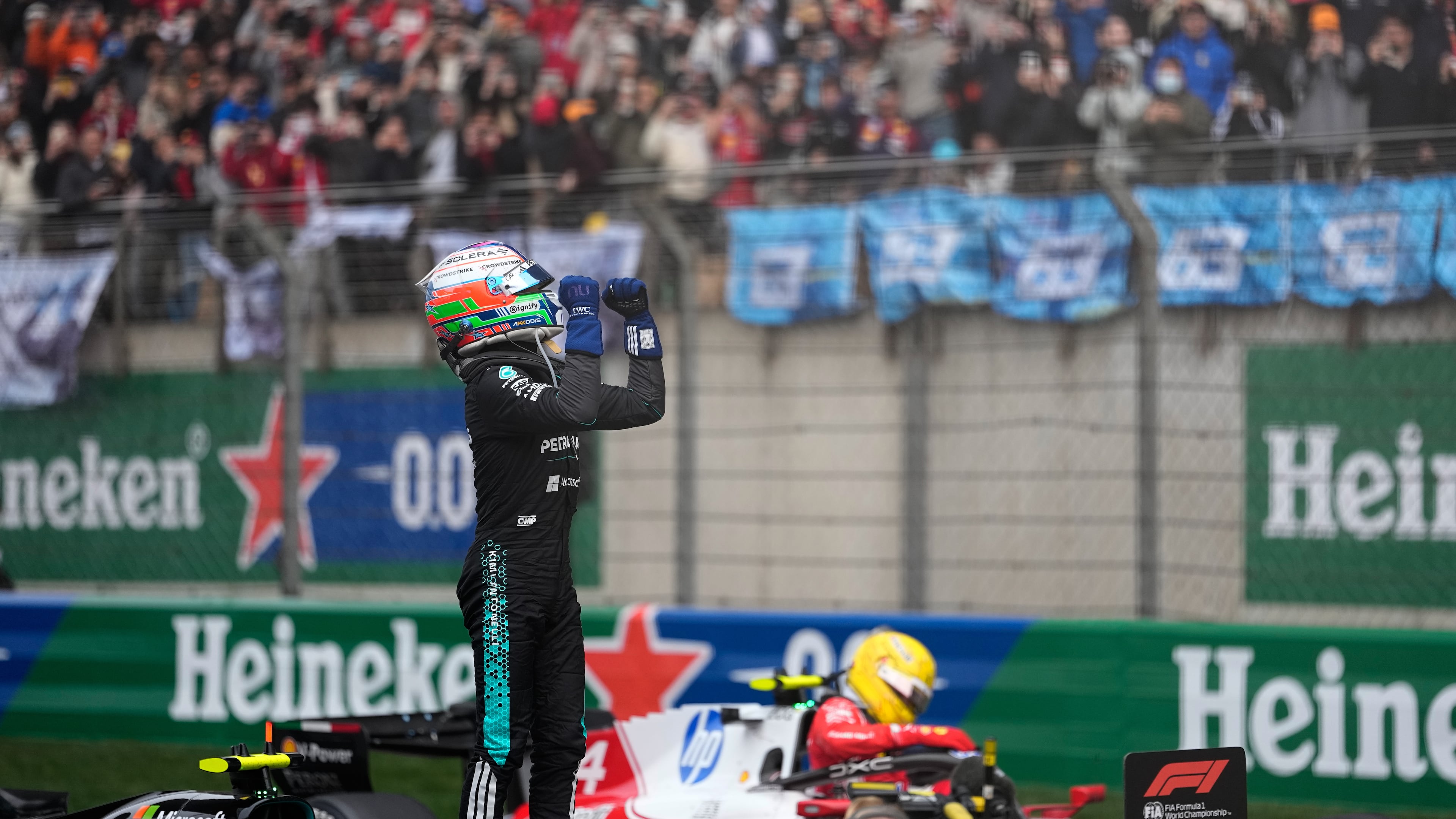 Mercedes driver Andrea Kimi Antonelli of Italy celebrates after he clocked the fastest time in the Chinese Formula One Grand Prix race at the Shanghai International Circuit, in Shanghai, China, Sunday, March 15, 2026. (AP Photo/Andy Wong)