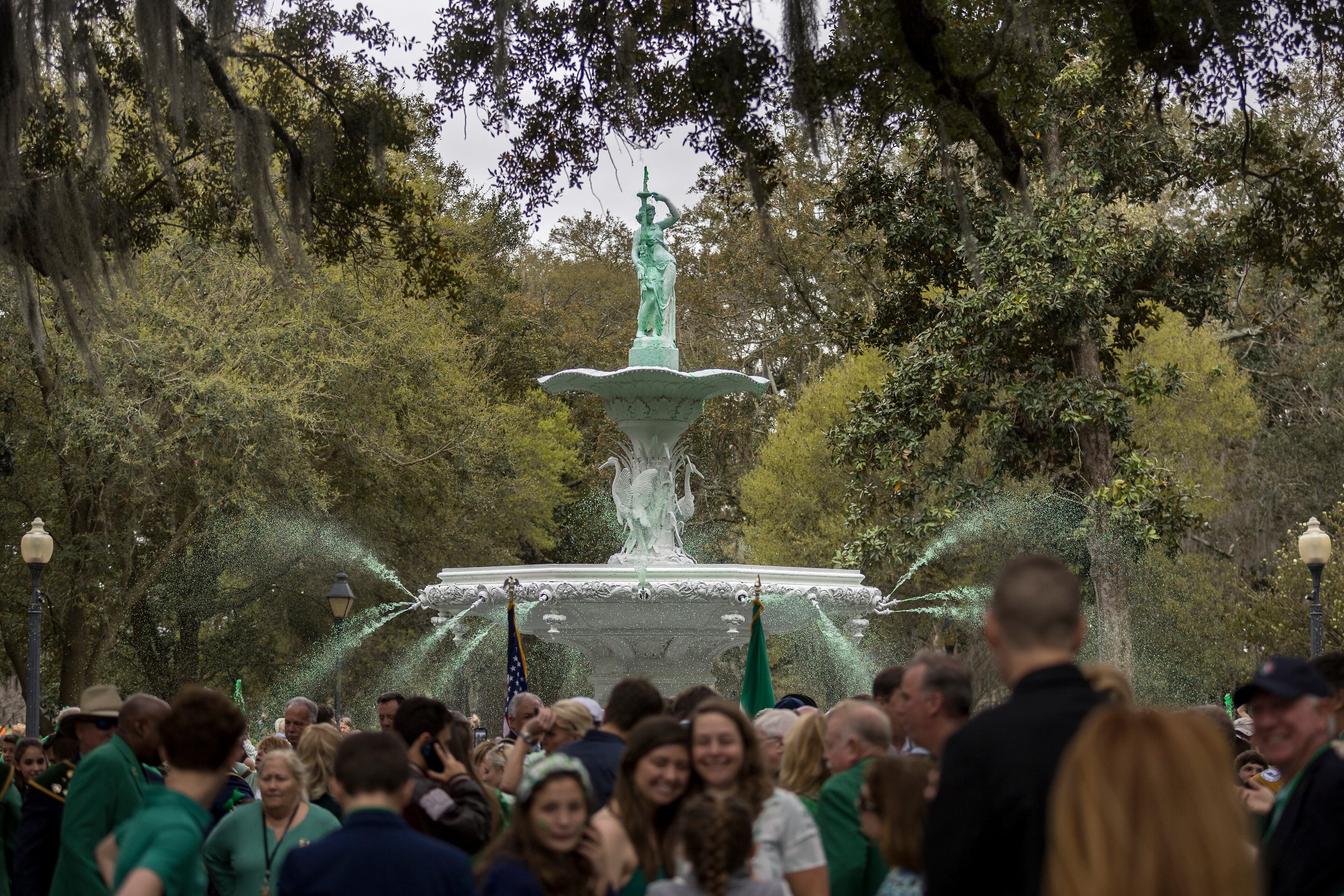 SAVANNAH, GA - MARCH 08, 2024: The statue atop the 30-foot tall Forsyth Fountain drips with green colored water during the Greening of the Fountain event celebrating the 200th anniversary of the Savannah St. Patrick's Day Parade, Friday, March 8, 2024, in Savannah, Ga. City workers dye several other fountains in downtown Savannah green ahead of the parade. (AJC Photo/Stephen B. Morton)