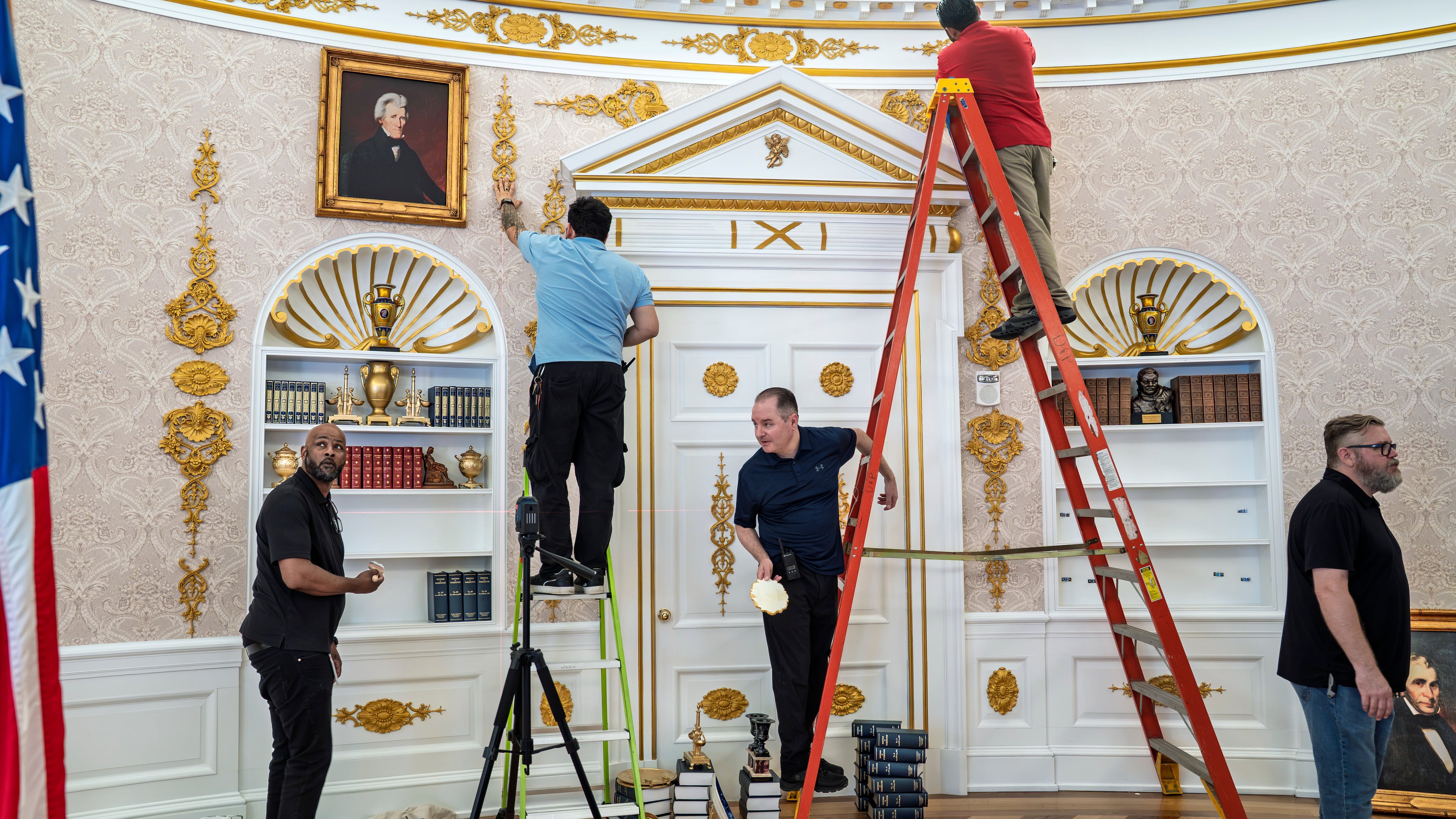 A replica of President Donald Trump's Oval Office is updated to the current decor by workers at "The People's House: A White House Experience," in Washington, Friday, Oct. 2, 2026. (AP Photo/J. Scott Applewhite)