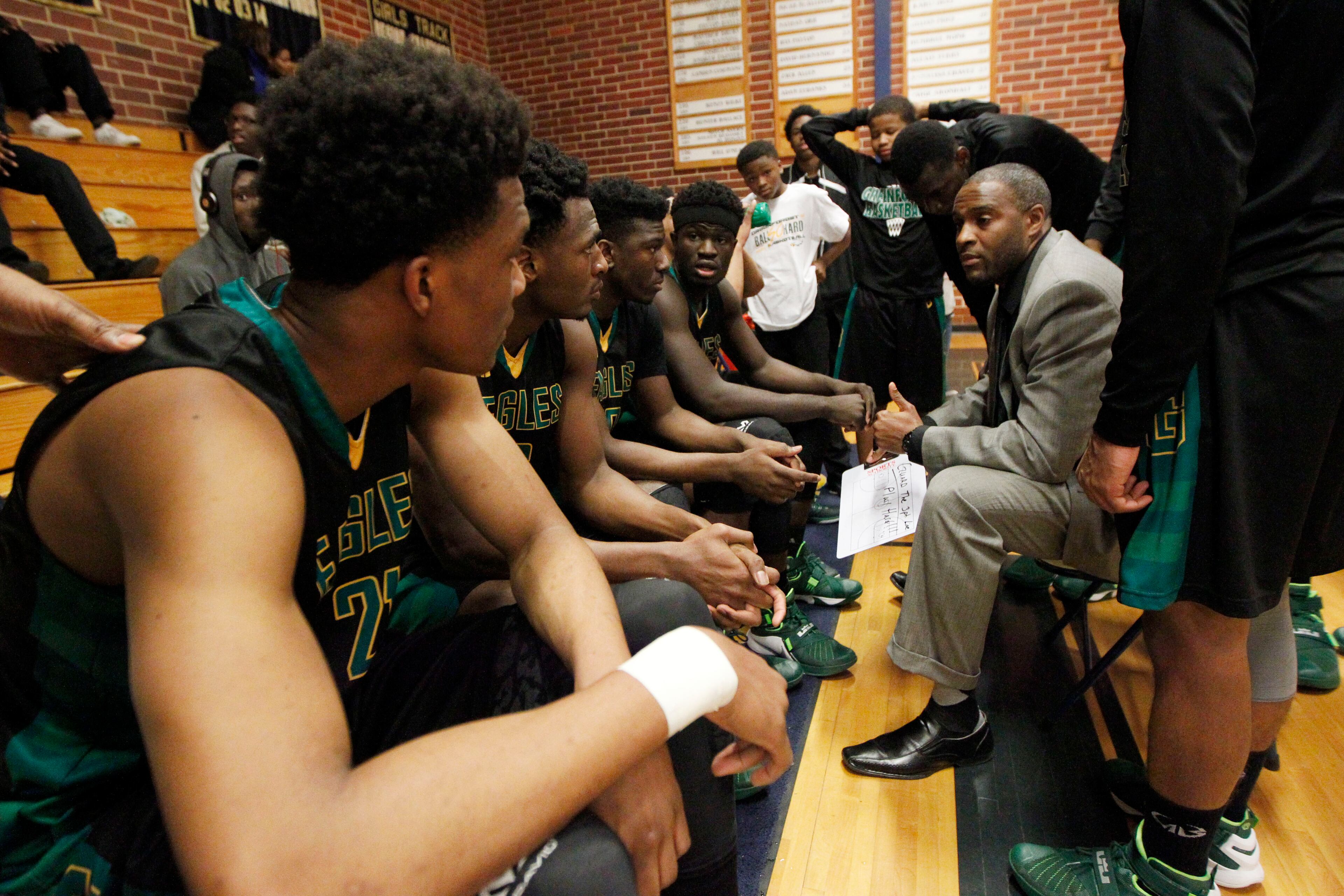 Greenforest Christian head coach Larry Thompson (R) talks to his players before their game against Landmark Christian at a high school basketball game at Landmark Christian school Friday, February 5, 2016. TAMI CHAPPELL/SPECIAL TO THE AJC