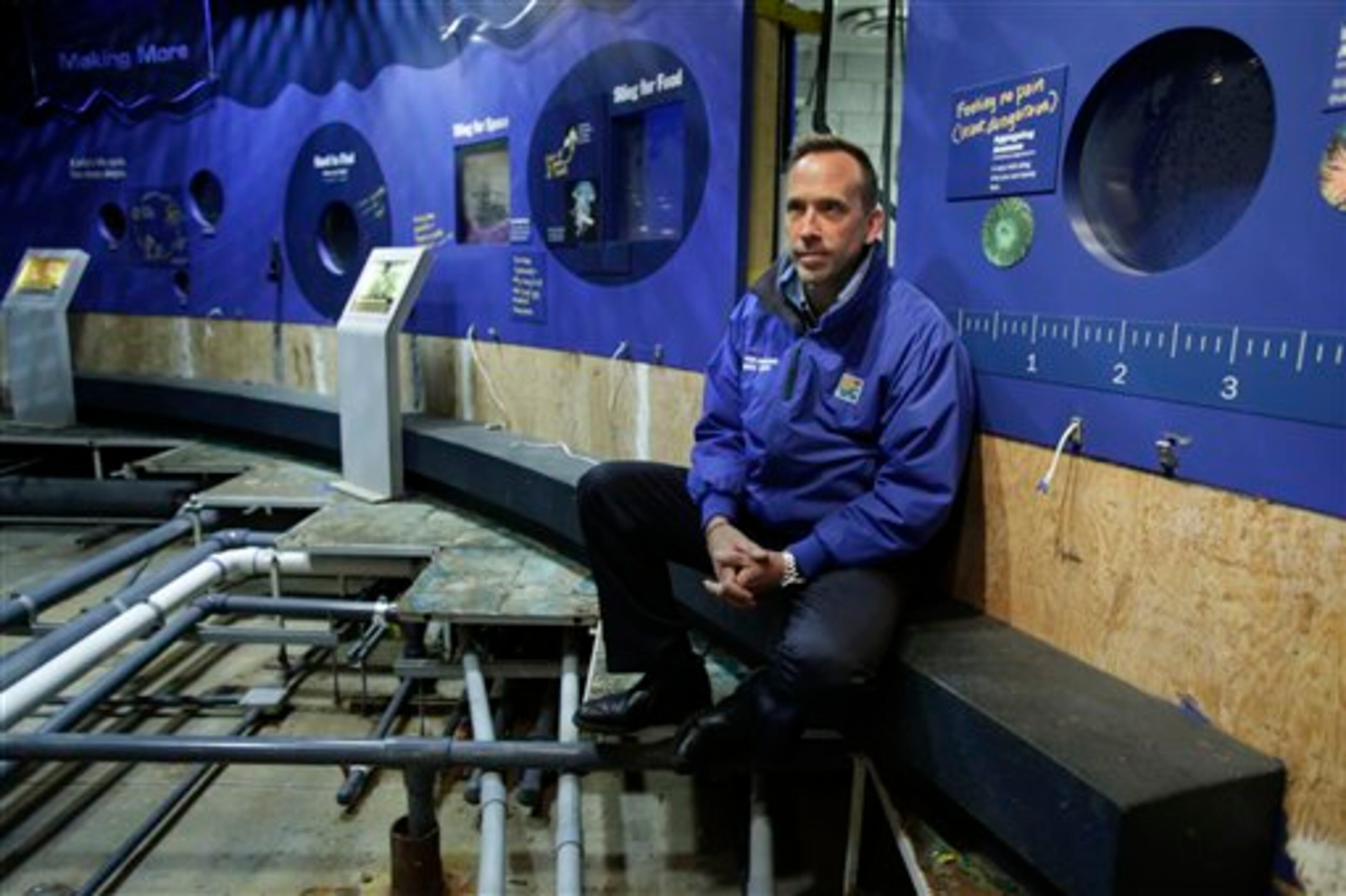 Director of the New York Aquarium, John Dohlin, poses for a picture at an exhibit ruined during Superstorm Sandy at the aquarium in Coney Island, New York, Monday, March 25, 2013. (AP Photo/Seth Wenig)