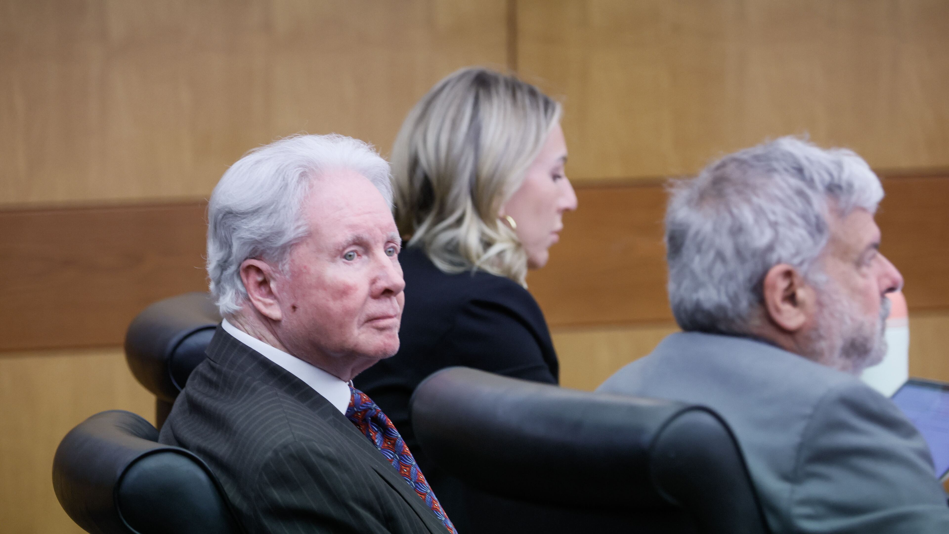 Claud “Tex” McIver attends court with his attorneys in December 2023. He was paroled Thursday, almost a year after he pleaded guilty to charges of involuntary manslaughter, reckless conduct and gun possession over the September 2016 shooting death of his wife, Diane McIver. (Miguel Martinez)