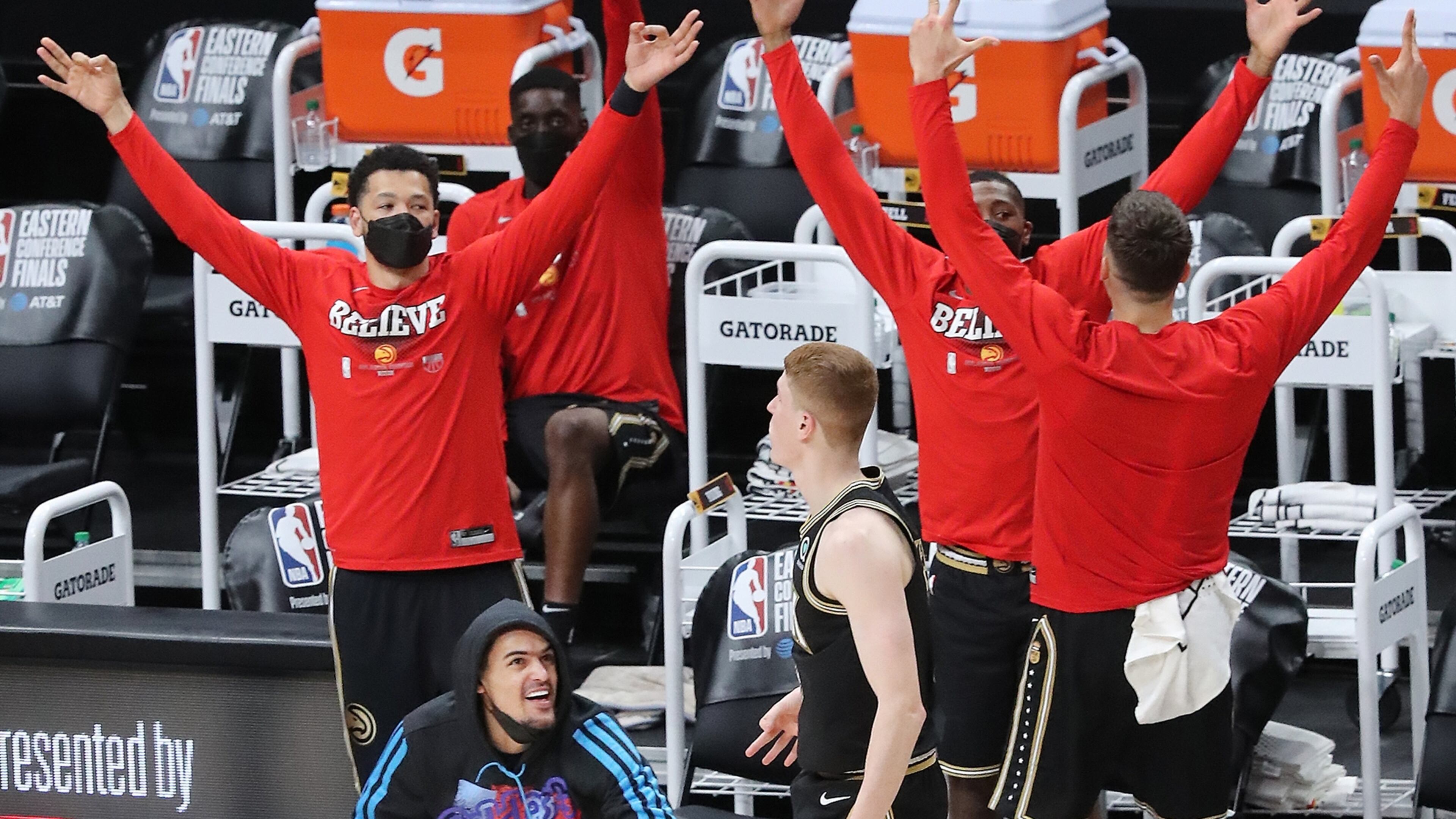 062921 Atlanta: Injured Atlanta Hawks guard Trae Young and the bench react as Kevin Huerter hits a three to take a 104-80 lead over the Milwaukee Bucks with 4:19 left during the fourth quarter in game 4 of the NBA Eastern Conference Finals on Tuesday, June 29, 2021, in Atlanta. The Hawks evened the series 2-2 with a 110-88 victory. “Curtis Compton / Curtis.Compton@ajc.com”