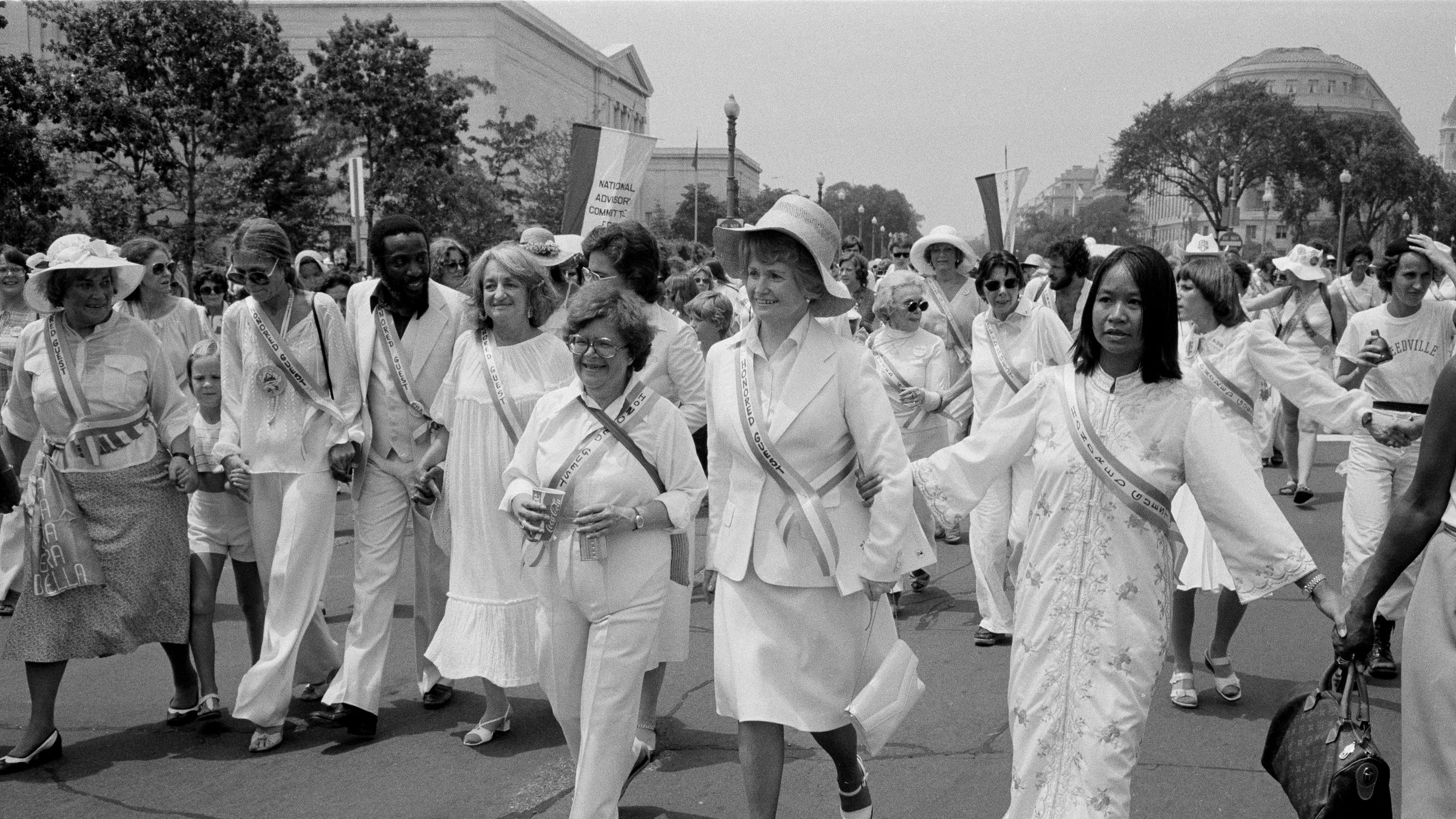 FILE - Leading supporters of the Equal Rights Amendment march in Washington, July 9, 1978, urging Congress to extend the time for ratification of the ERA. From left are: Gloria Steinem; Dick Gregory; Betty Friedan; Rep. Elizabeth Holtzman, D-N.Y. (partially obscured); Rep. Barbara Mikulski, D-Md.; and Rep. Margaret Heckler, R-Mass. The women at far left and right are unidentified. (AP Photo/Dennis Cook, File)