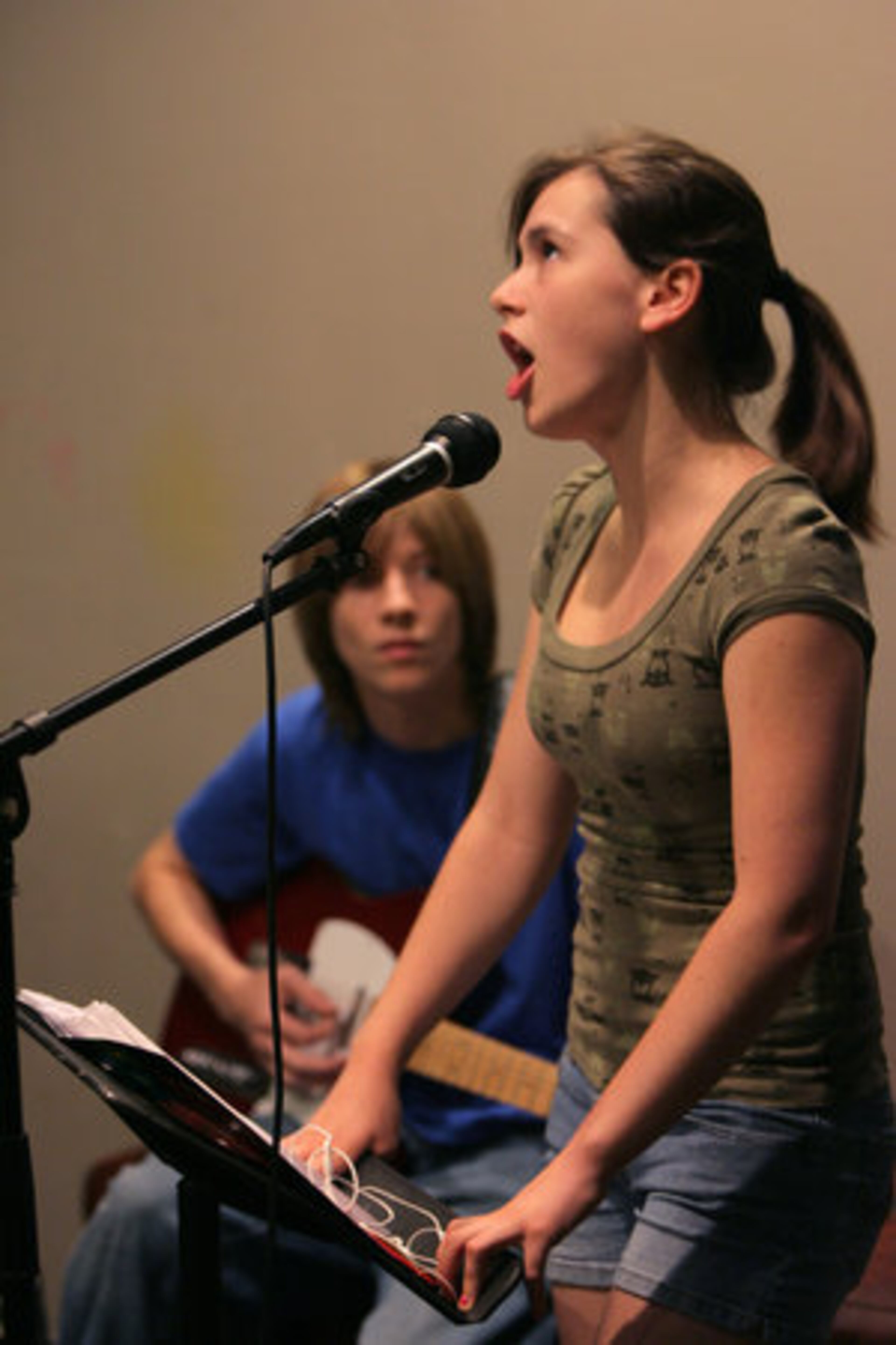 Emma Cooke, 16, belts out Jefferson Airplane's "Somebody to Love" with guitarist Hank Frantz, 15. Their band is called Banana Holsterz. Cooke, 16, said her dad raised her on "everything from Bonnie Raitt to reggae."