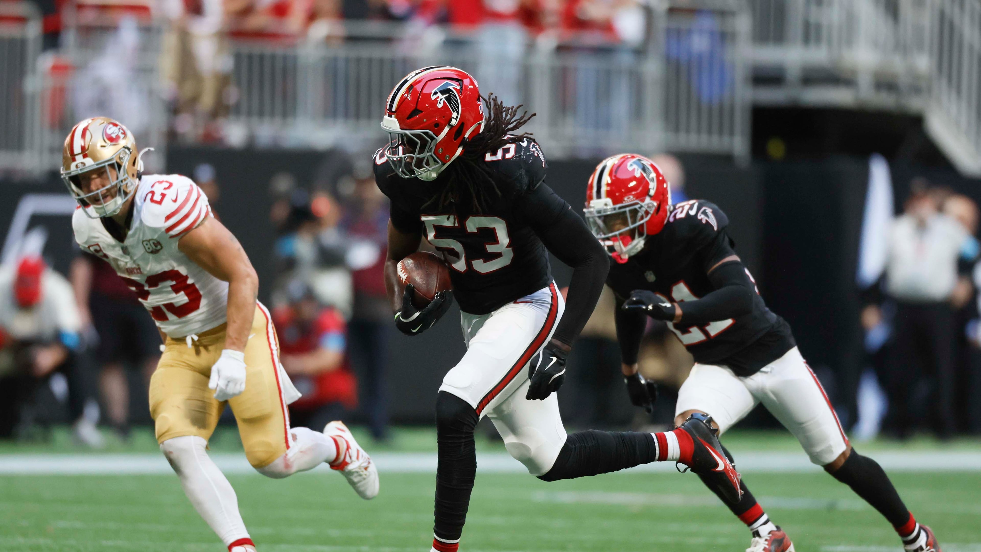 Atlanta Falcons linebacker Kendal Daniels runs with the ball following an interception in the second half of a football game against the San Francisco 49ers at Mercedes-Benz Stadium in Atlanta on Sunday, Oct. 25, 2026. (Miguel Martinez/AJC)