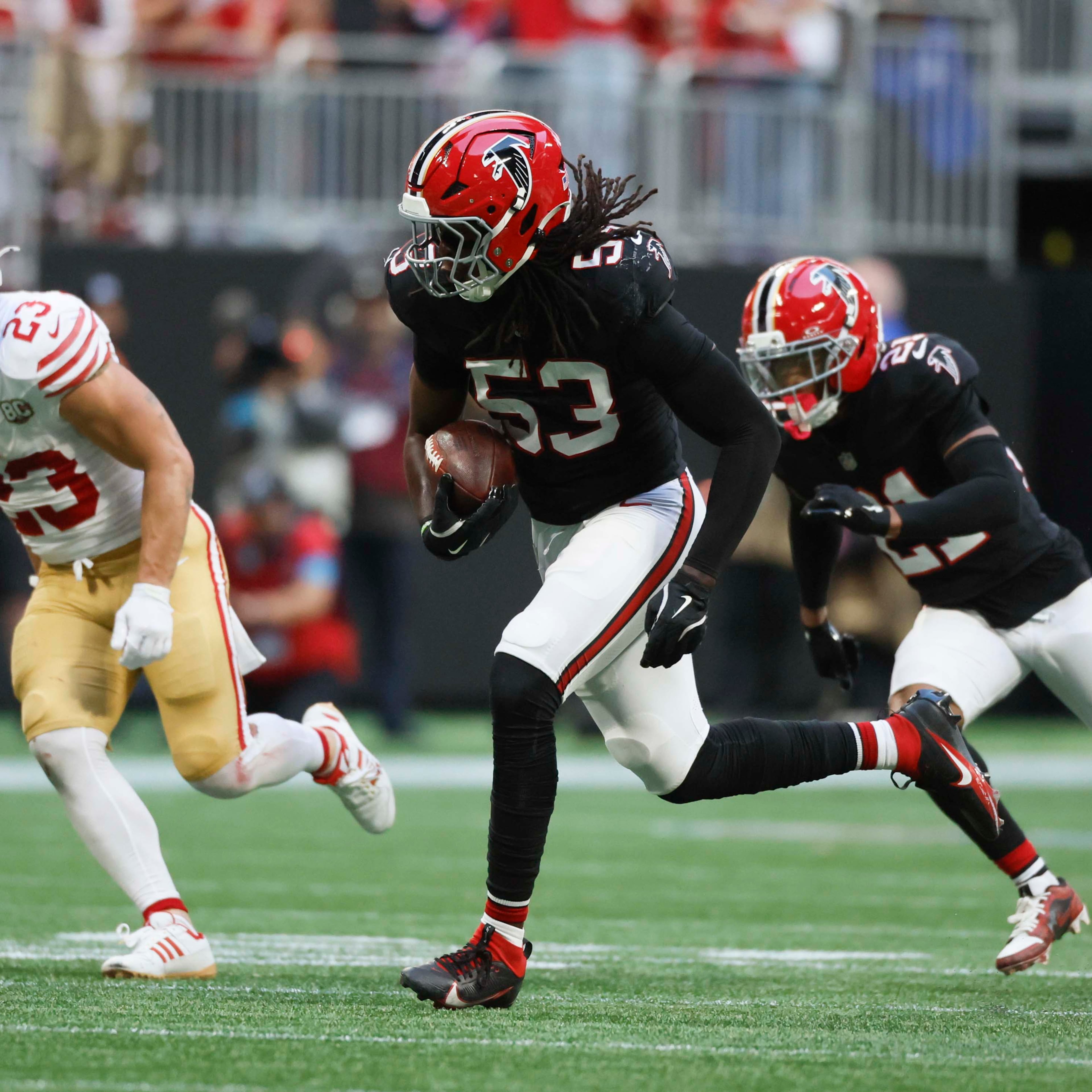 Atlanta Falcons linebacker Kendal Daniels runs with the ball following an interception in the second half of a football game against the San Francisco 49ers at Mercedes-Benz Stadium in Atlanta on Sunday, Oct. 25, 2026. (Miguel Martinez/AJC)
