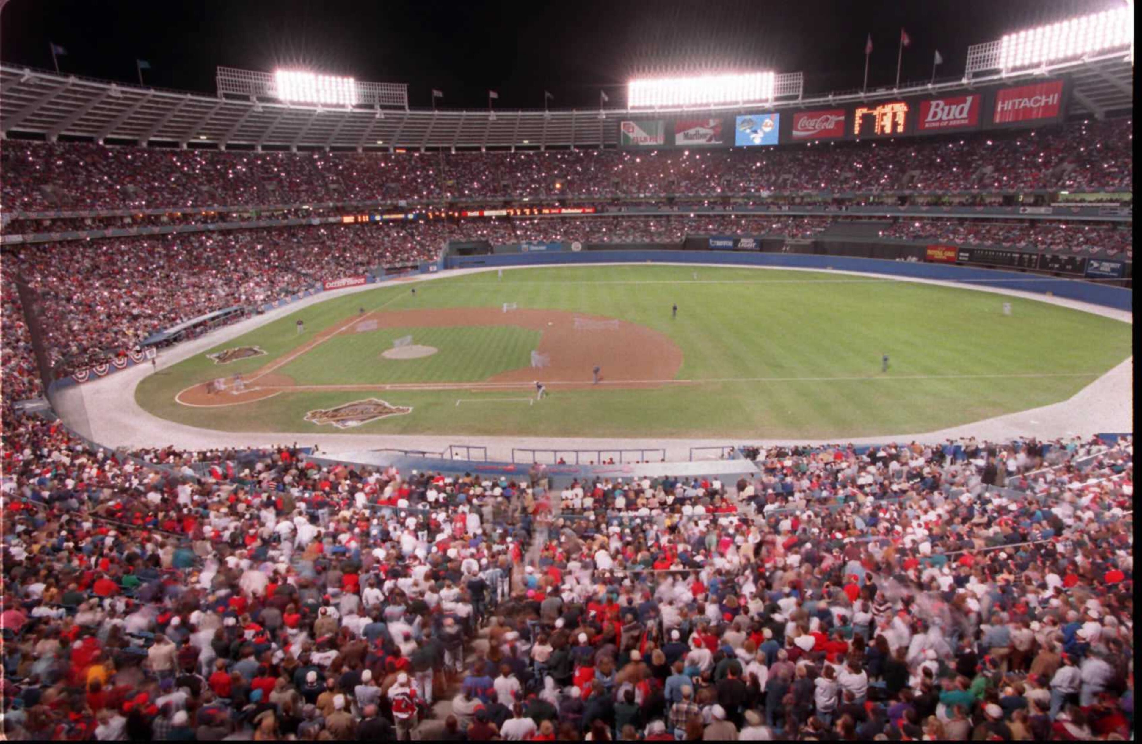 OCTOBER 21, 1995 ATLANTA: Thousands of flashbulbs go off as Braves' starter Greg Maddux throws the first pitch of the 1995 World Series in Atlanta 10/21. This timed exposure picture was made with a radio controlled remote camera at 4-seconds. (AJC photo/David Tulis)