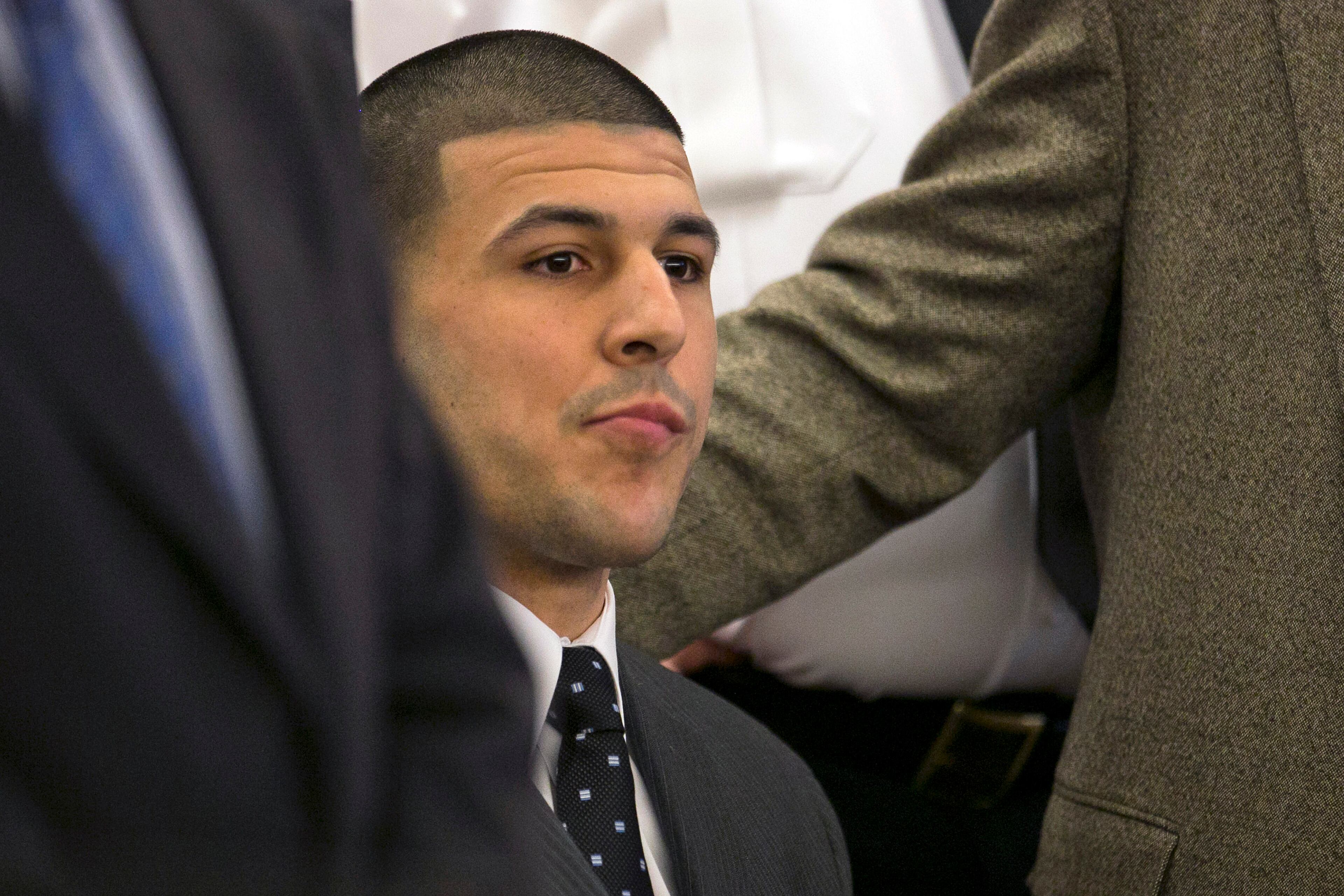 Former New England Patriots football player Aaron Hernandez listens as the guilty verdict is read during his murder trial at the Bristol County Superior Court in Fall River, Mass., Wednesday, April 15, 2015. Hernandez was found guilty of first-degree murder in the shooting death of Odin Lloyd in June 2013. He faces a mandatory sentence of life in prison without parole. (Dominick Reuter/Pool Photo via AP)