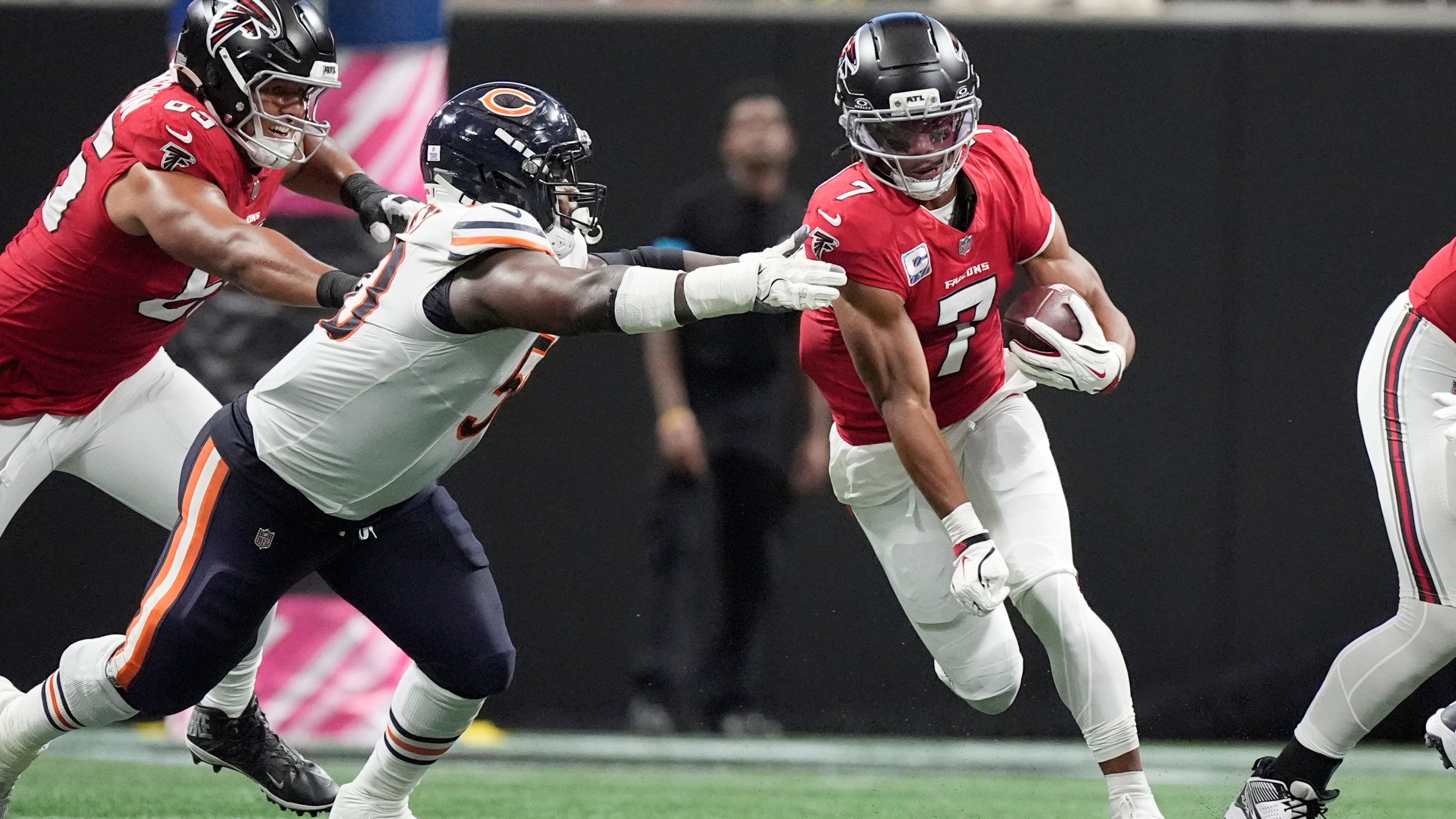 Atlanta Falcons running back Bijan Robinson (right) tries to get past Chicago Bears defensive tackle Grady Jarrett during the first half of an NFL football game in Atlanta, Sunday, Oct. 18, 2026. (Mike Stewart/AP)