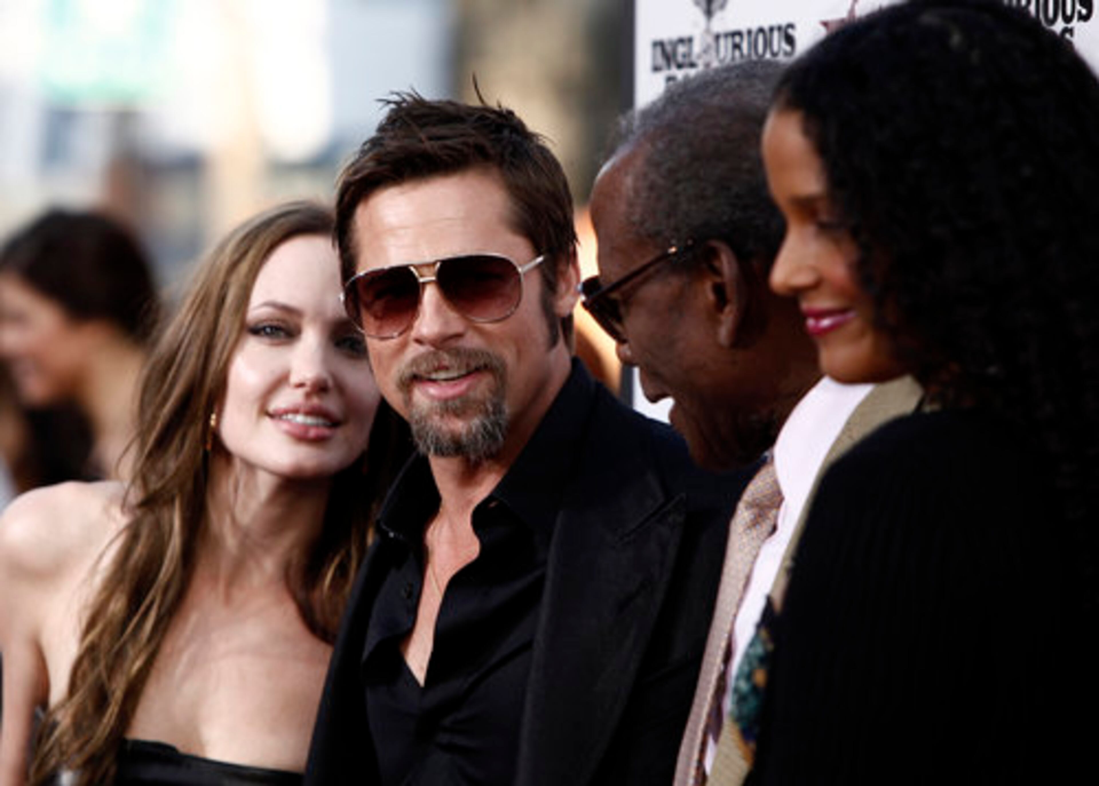 EVEN WITH a screen legend in the frame (Poitier at second right), the photographer who took this picture still focused on Angelina. Tough luck, Sidney.