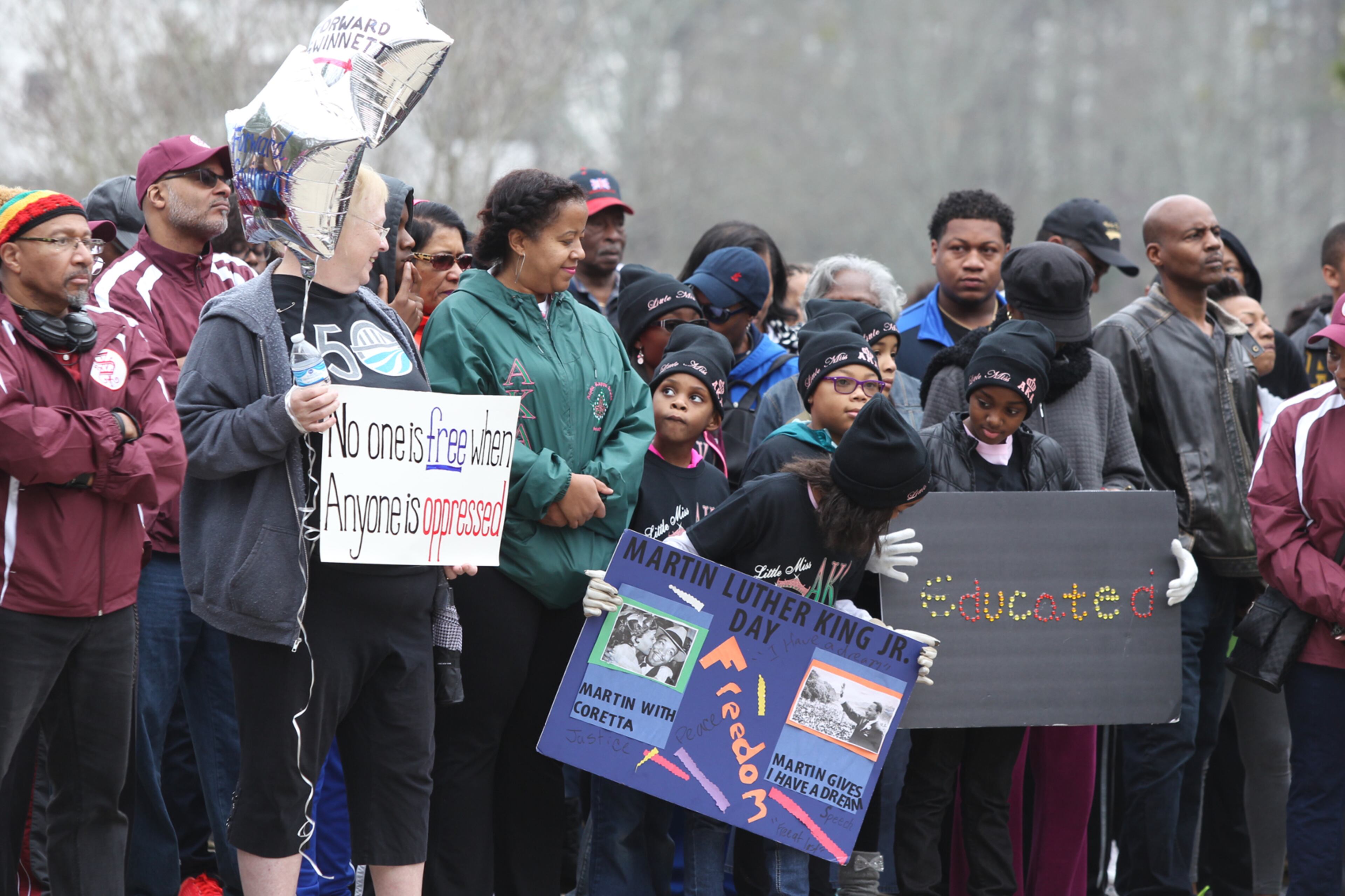 January 16, 2017, Atlanta - Members of different organizations with an array of things to say stand next to one another in celebration of Martin Luther King Jr on MLK Day in Atlanta, Georgia, on Monday, January 16, 2017. (HENRY TAYLOR / HENRY.TAYLOR@AJC.COM)