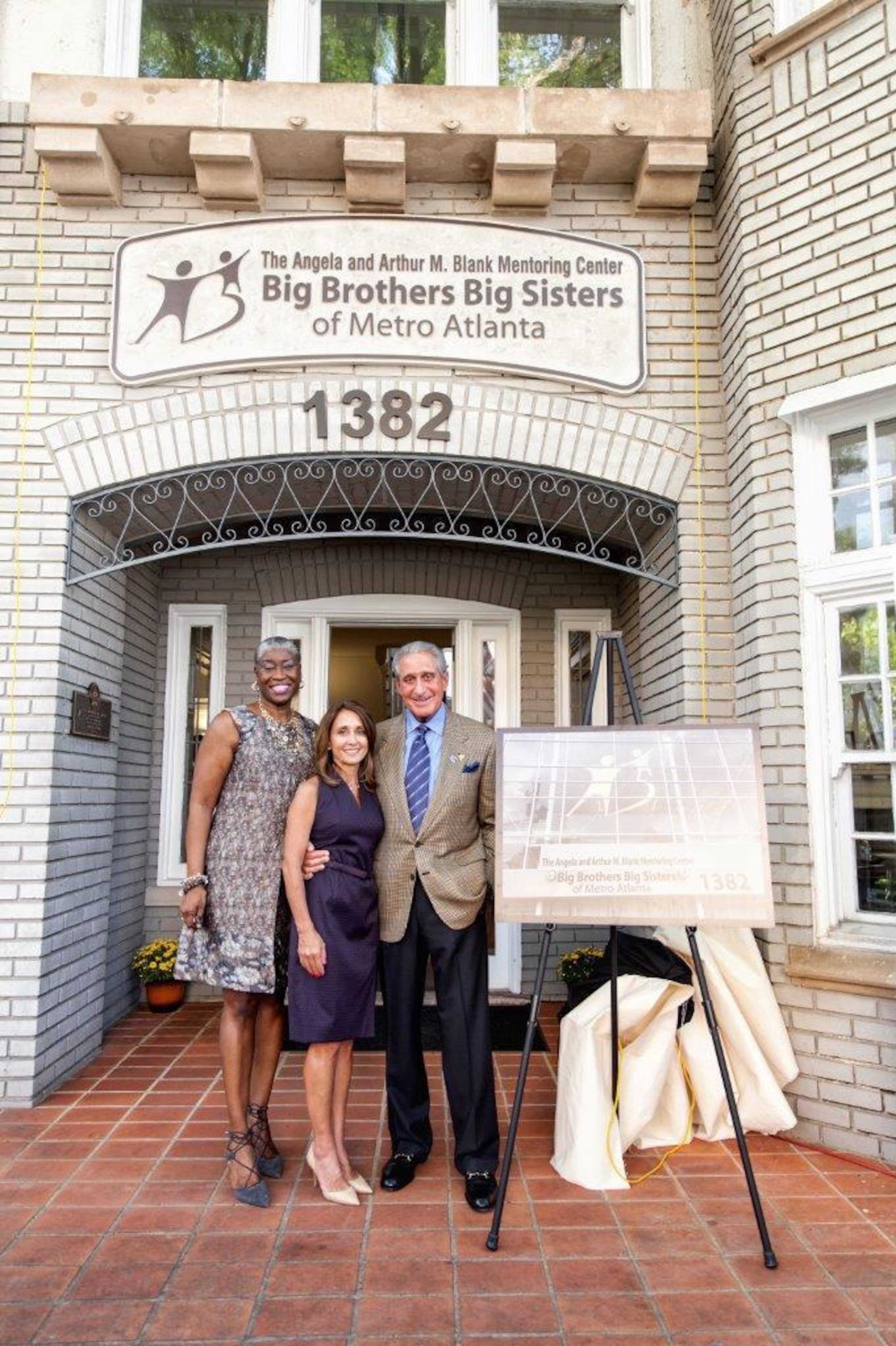 Janice McKenzie-Crayton poses with Angela and Arthur Blank during the successful completion of a fund drive that allowed her organization to buy a new facility in Midtown Atlanta. Photo: courtesy Big Brothers and Big Sisters of Metro Atlanta
