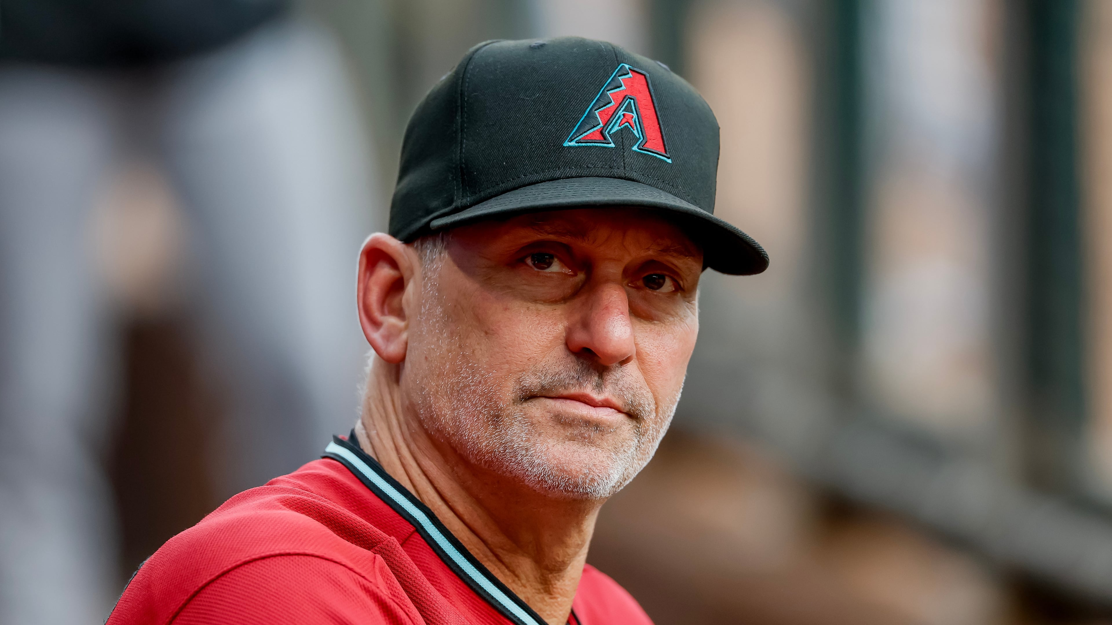 Arizona Diamondbacks manager Torey Lovullo in the dugout before the first pitch of a baseball game against the Atlanta Braves, Saturday, Aug. 15, 2026, in Atlanta. (AP Photo/Erik S. Lesser)