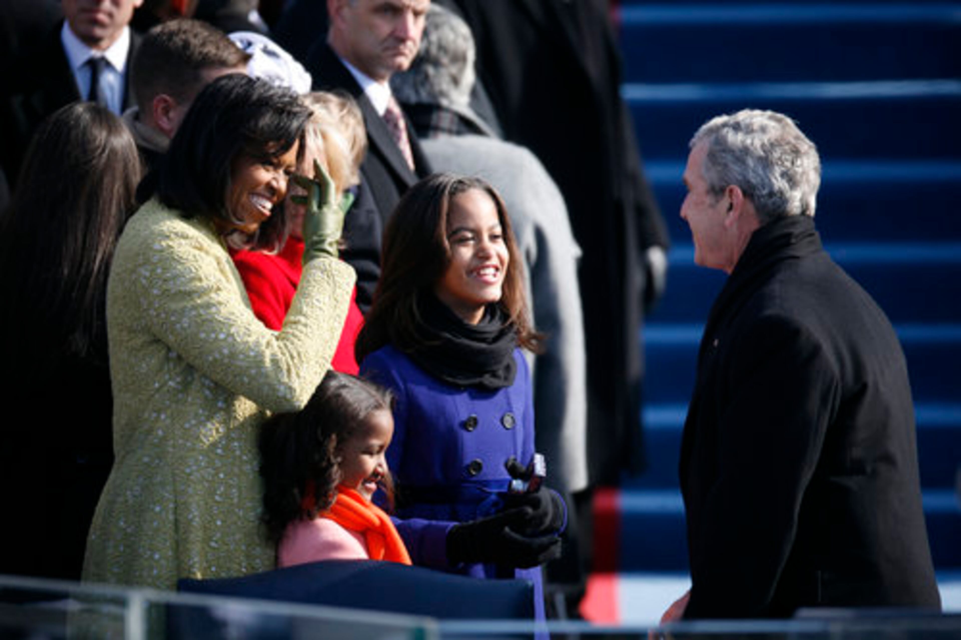 During ceremonies inaugurating Barack Obama as the 44th president of the United States, Michelle Obama and her daughters had warm smiles for President George Bush.