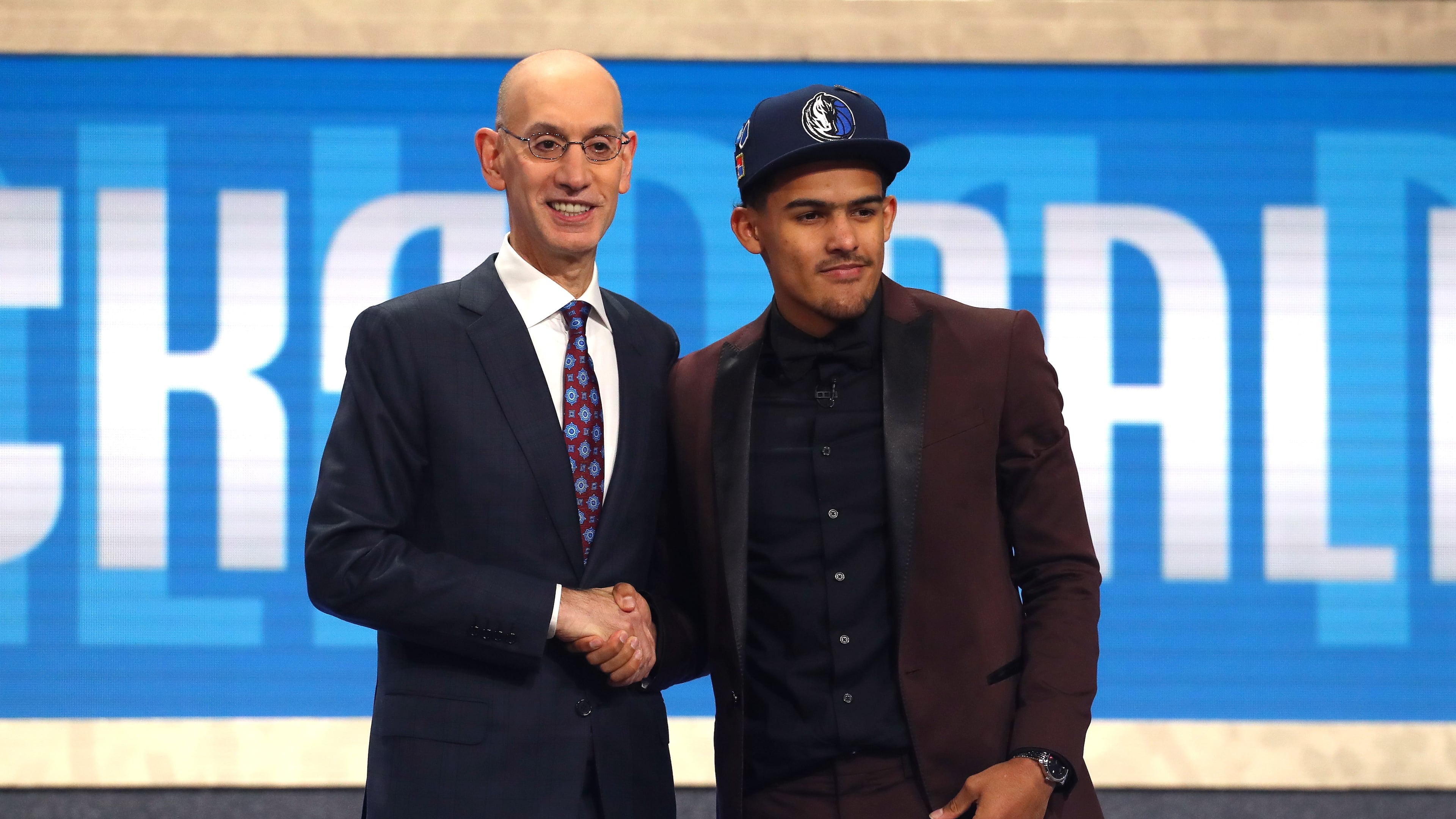 Trae Young poses with NBA Commissioner Adam Silver after being drafted fifth overall by the Dallas Mavericks during the 2018 NBA Draft on June 21, 2018 in the Brooklyn, New York. (Photo by Mike Stobe/Getty Images)