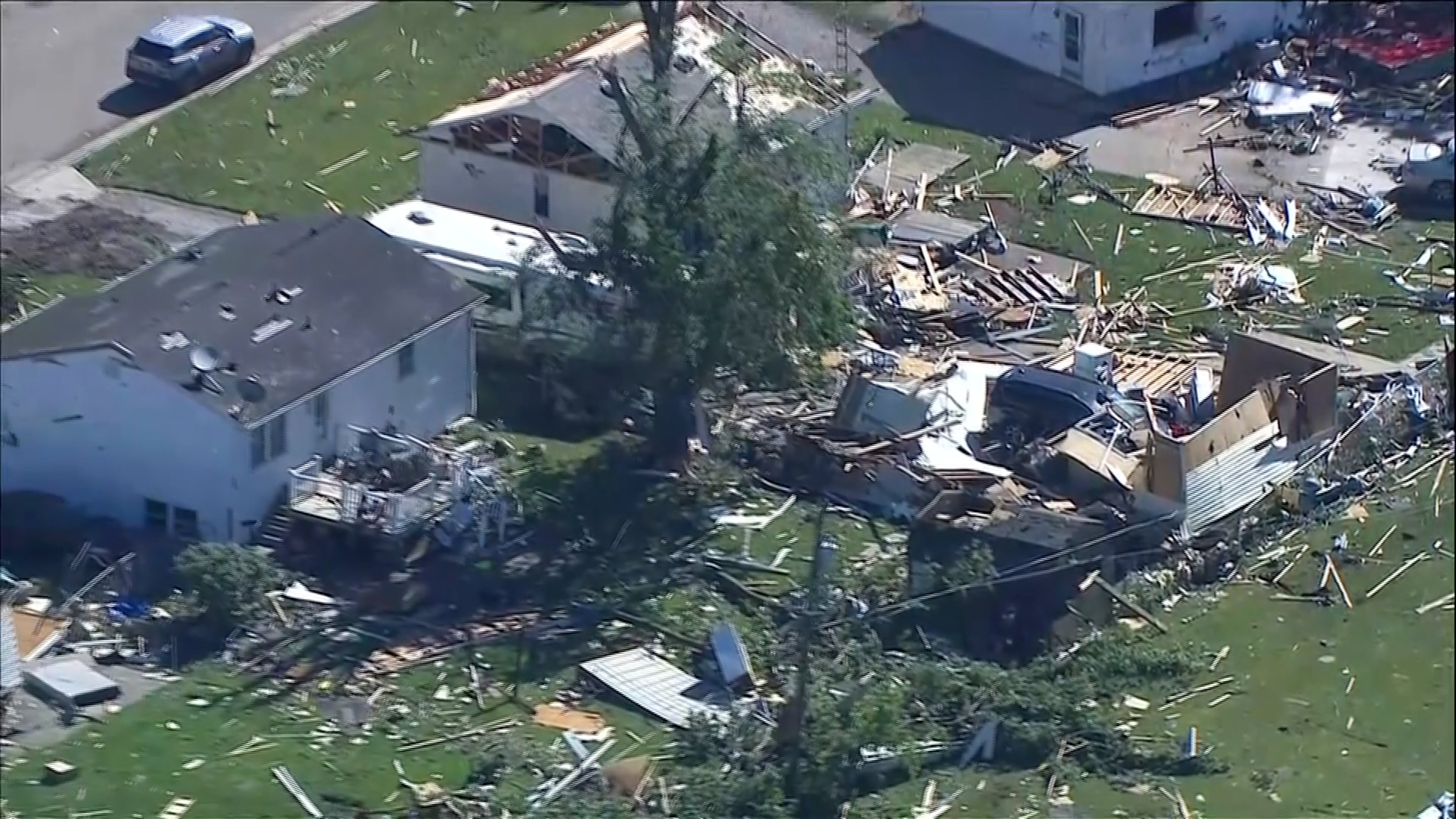 This photo made from video provided by WLS shows an aerial view of storm damage and a tornado-ravaged area on Friday, June 12, 2026, in Merrillville, Ind. (WLS via AP)