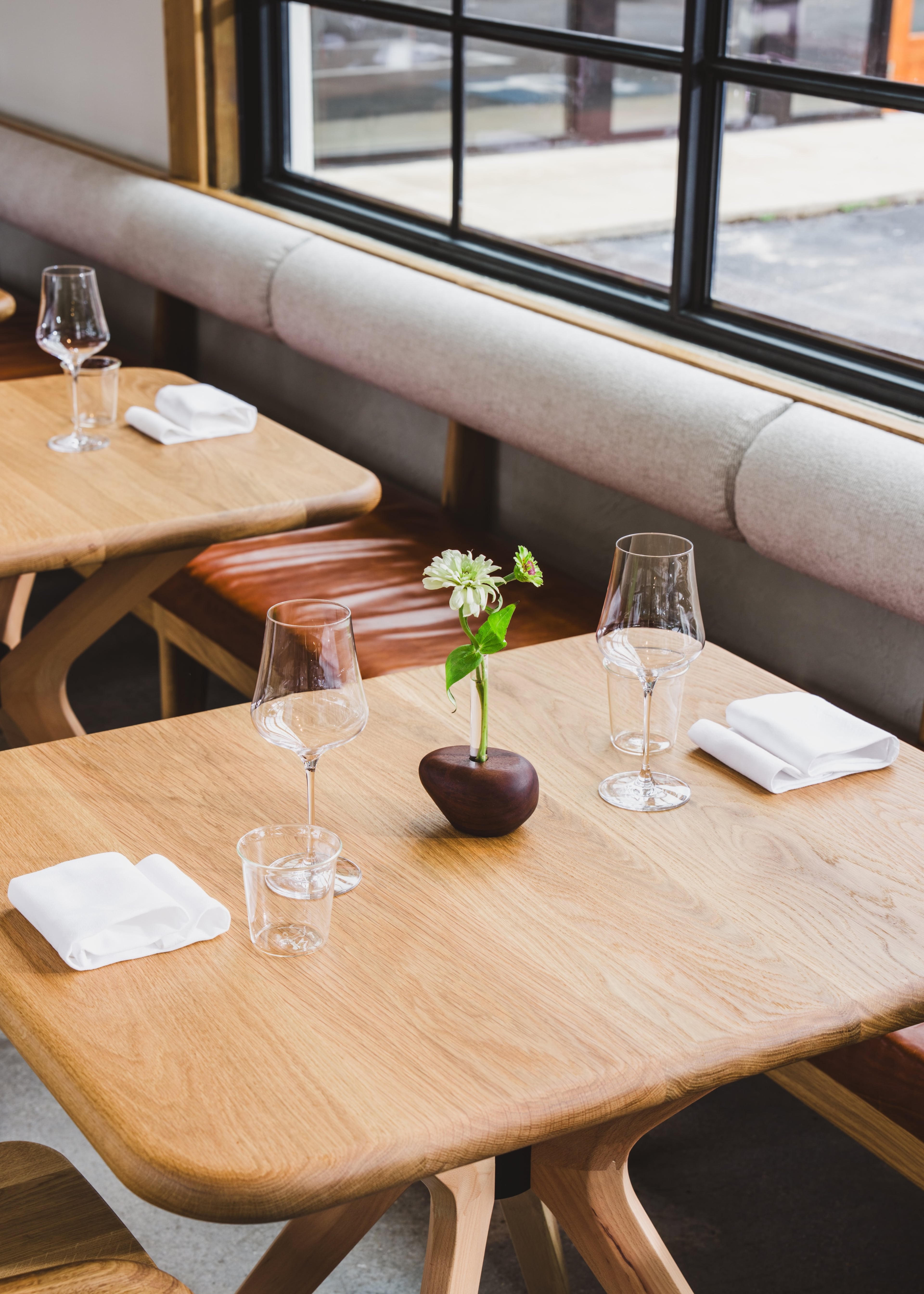 The interior at So. Fox is minimalist but deeply considered, with oversized tables and comfortable seating. (Dave Crawford/Courtesy of So. Fox)