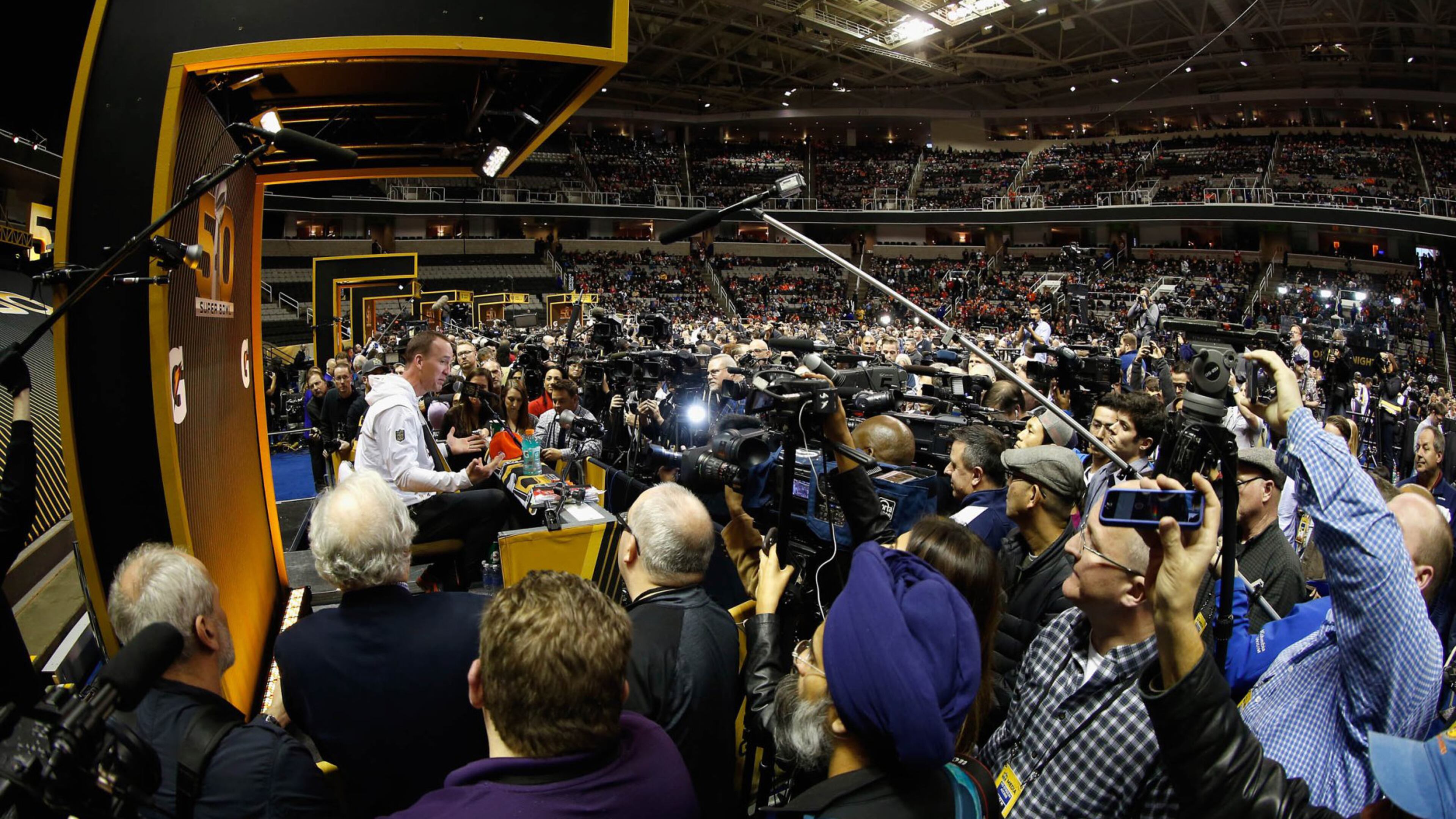 If Matt Ryan and the Falcons are seeking some insight on what “Opening Night” (formerly known as “Media Day”) will be like at the Super Bowl in Houston Monday night, this picture with former Denver quarterback Peyton Manning should give them some idea. (Getty Images)