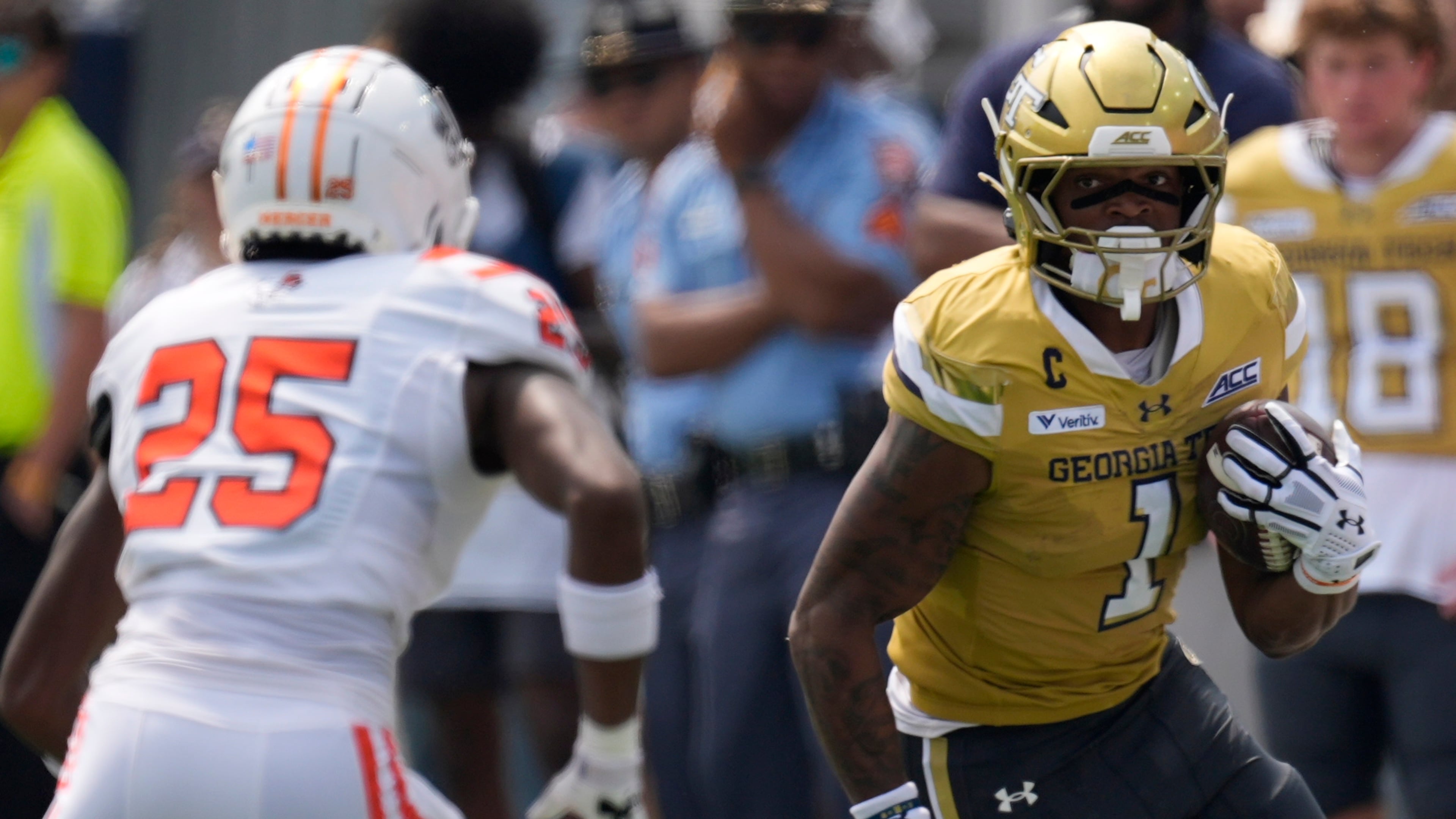 Georgia Tech running back Trelain Maddox avoids Mercer linebacker Evin McDowell in the first half of Saturday's game in Atlanta. (Mike Stewart/AP)