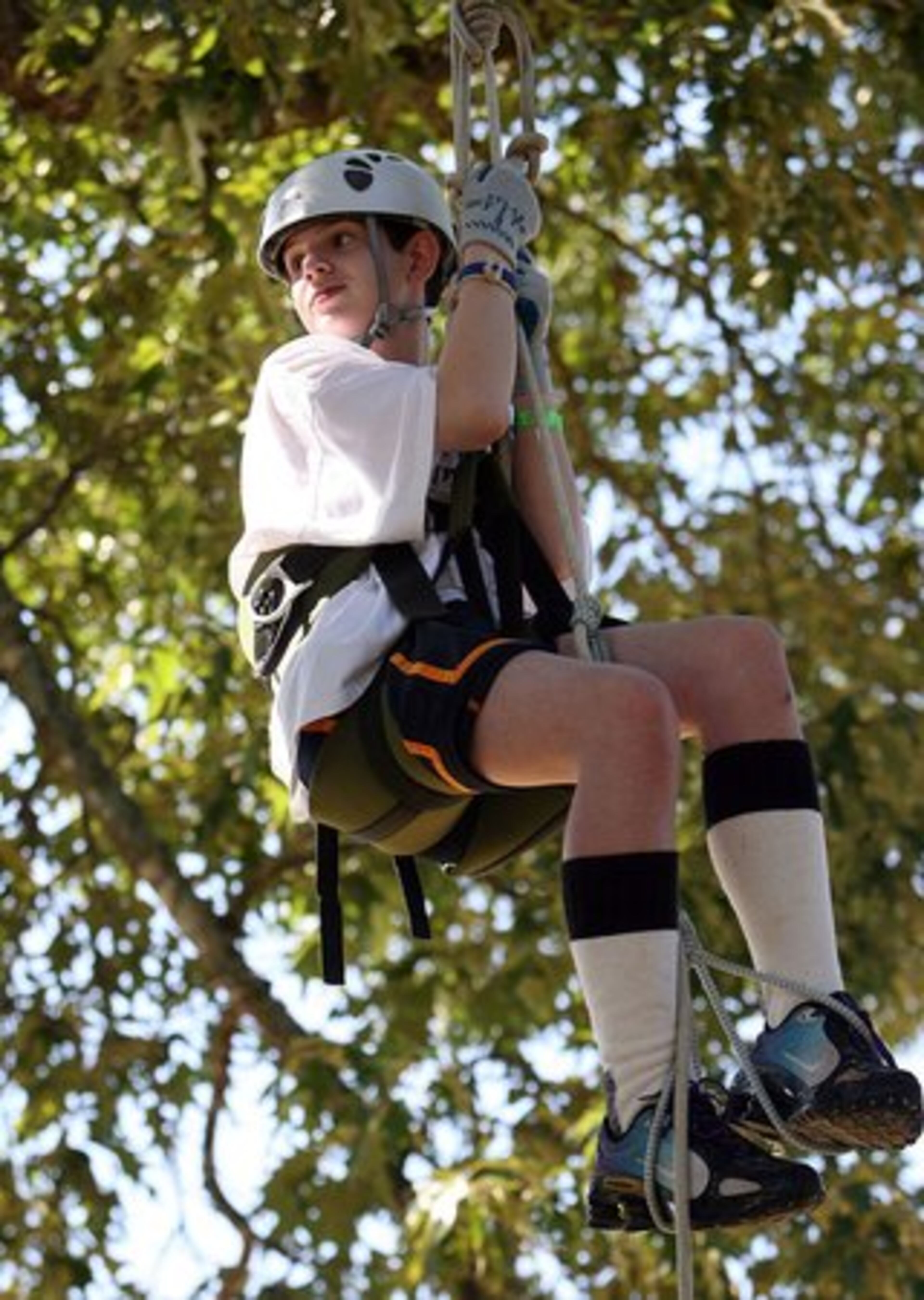 Casey Eaton learns tree climbing.