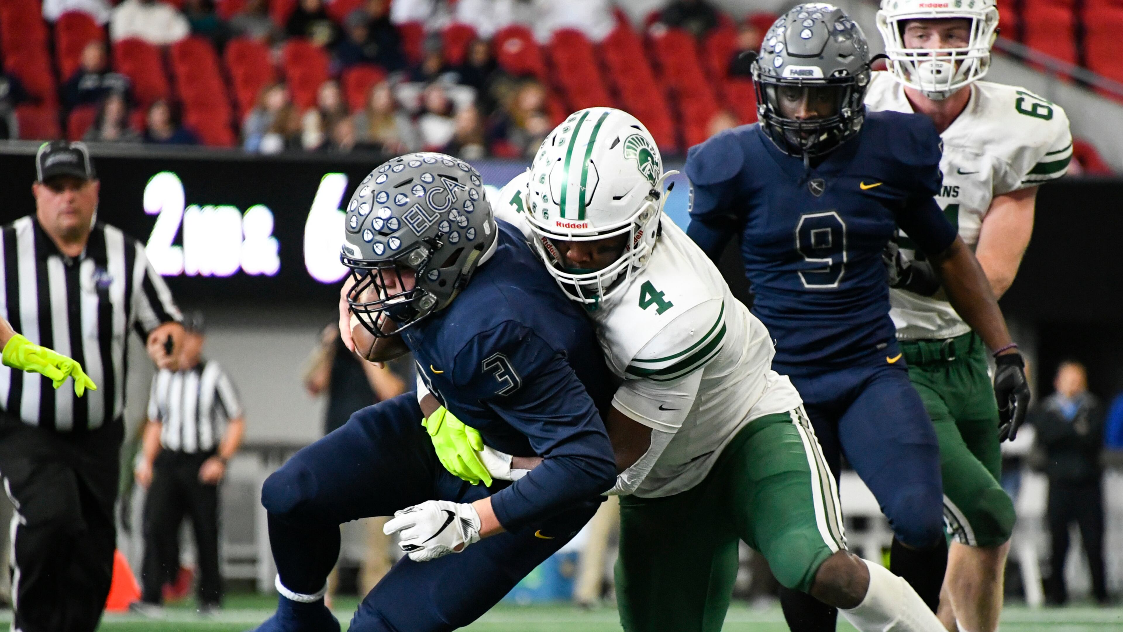 Athens Academy LB Len'neth Whitehead (4) takes down Eagle's Landing Christian Academy QB Brayden Rush during a class A Private high school championship football game at Mercedes-Benz Stadium, Wednesday, Dec. 12, 2018 in Atlanta. (John Amis/Special)