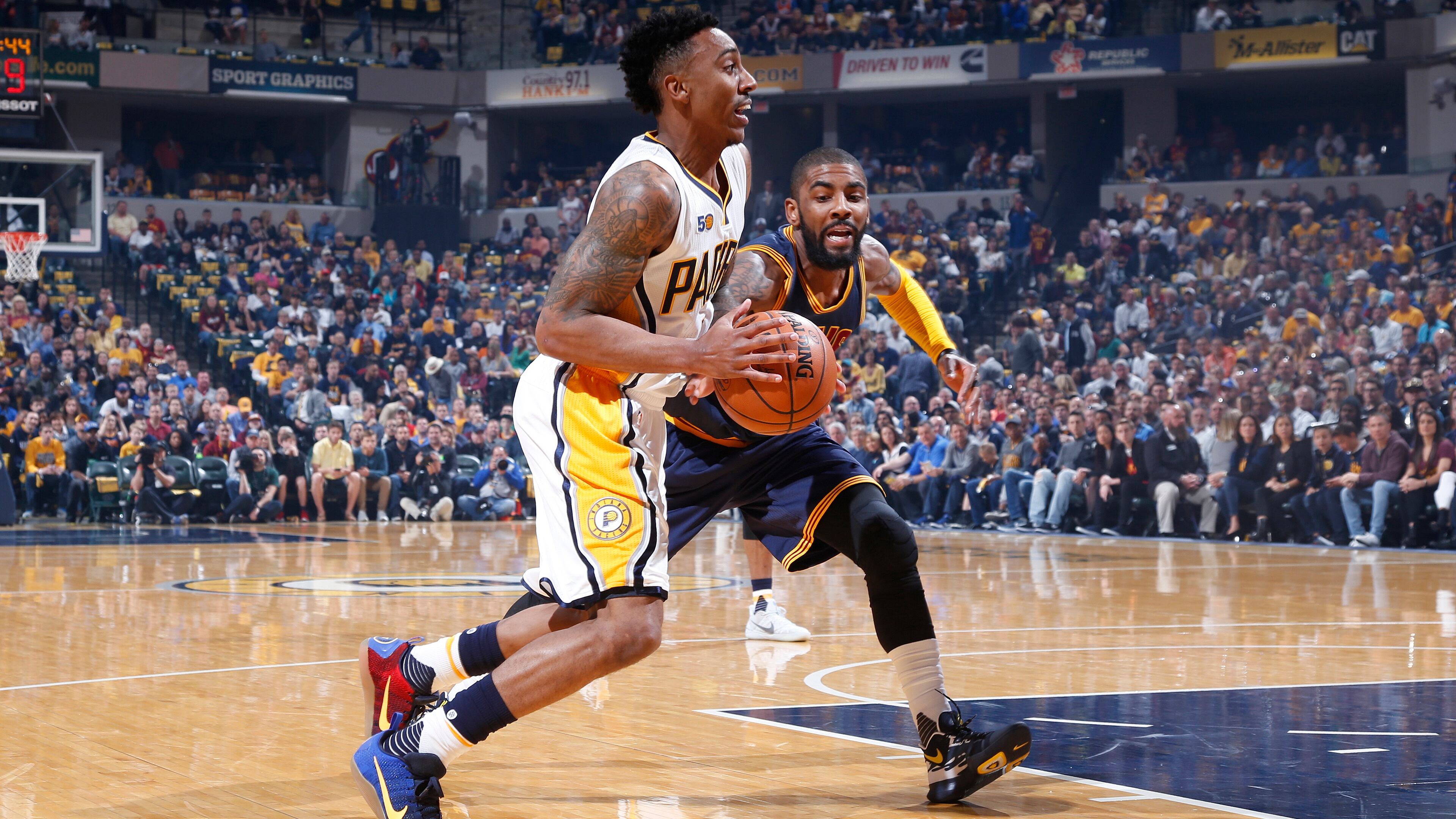 Jeff Teague of the Indiana Pacers drives to the basket against Kyrie Irving of the Cleveland Cavaliers in the first half of Game 4 of the Eastern Conference Quarterfinals during the 2017 NBA Playoffs at Bankers Life Fieldhouse on April 23, 2017 in Indianapolis, Indiana. (Photo by Joe Robbins/Getty Images)