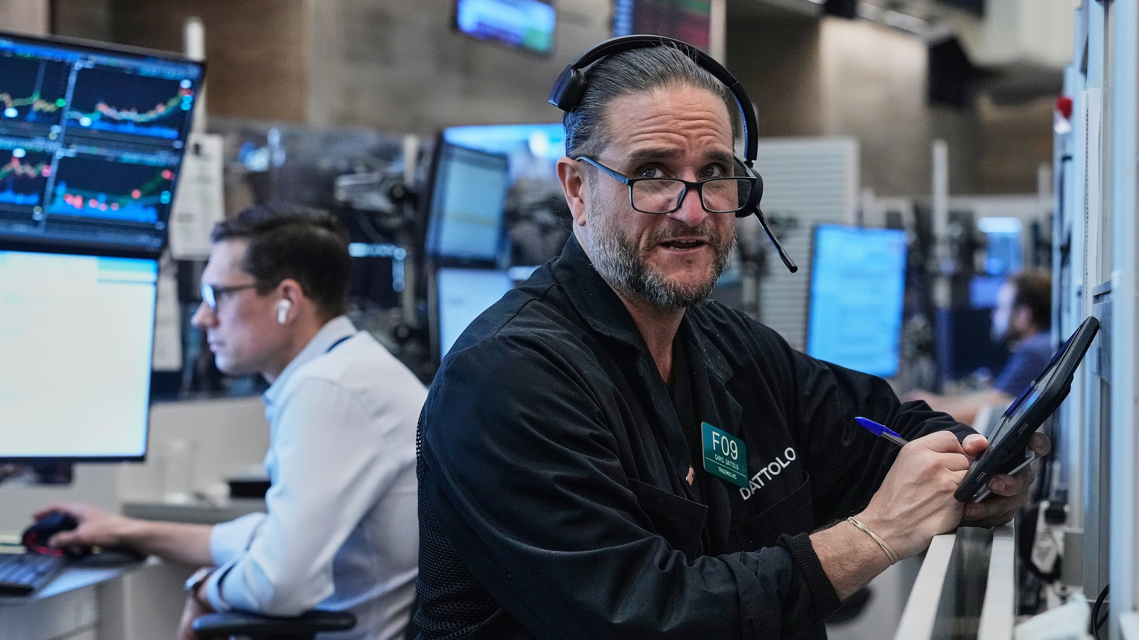 Options trader Chris Daytona, right, works on the floor of the New York Stock Exchange, Wednesday, June 3, 2026. (AP Photo/Richard Drew)