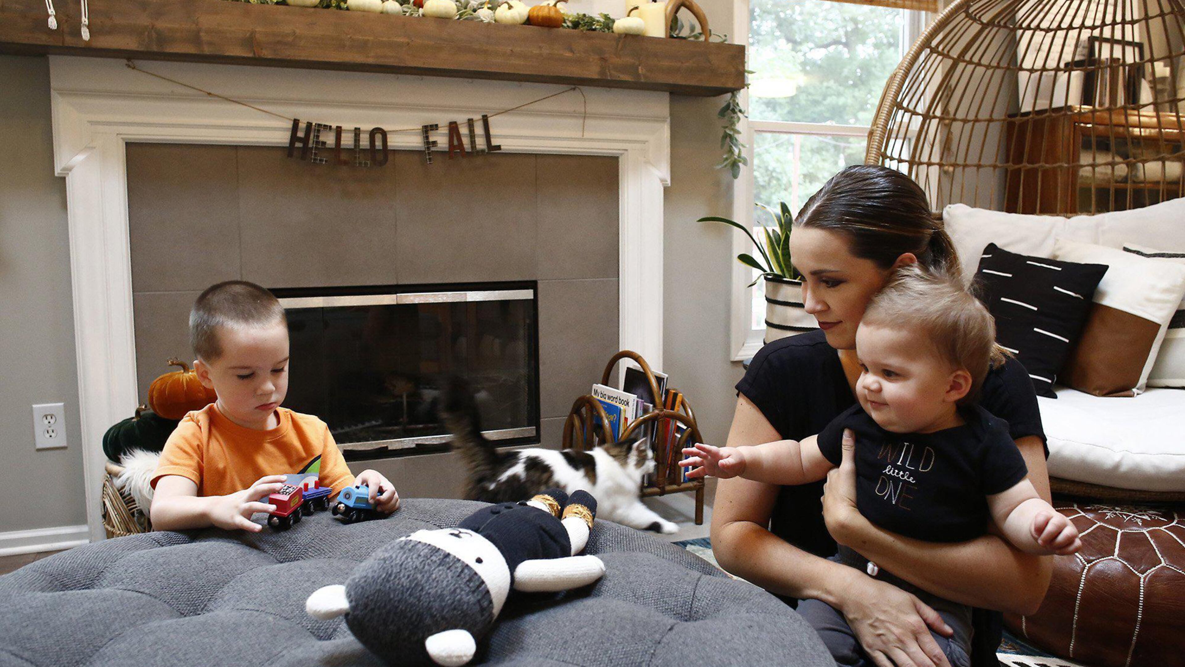 Kelly Pohly left her marketing job in July to stay home with their three sons after the pandemic increased stress about finding child care, working from home and figuring out the boys' schooling. She is seen with sons Anderson, 3, and Graham, 10 months old, at their Westerville, Ohio, home. (Fred Squillante/Columbus Dispatch/TNS)