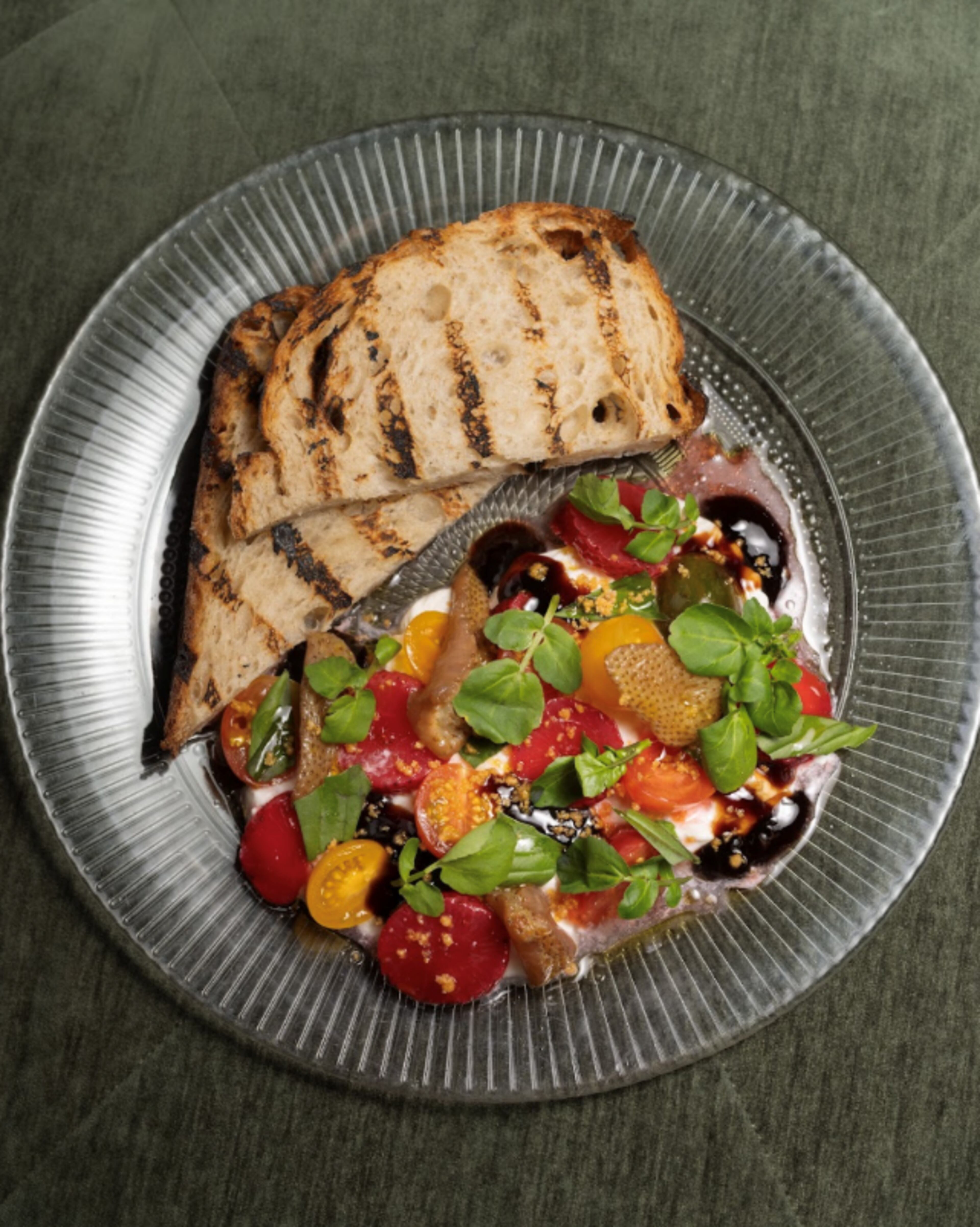 Burrata with strawberries and tomatoes are on the new menu at Atrium in Ponce City Market. (Courtesy of Oliva Restaurant Group)