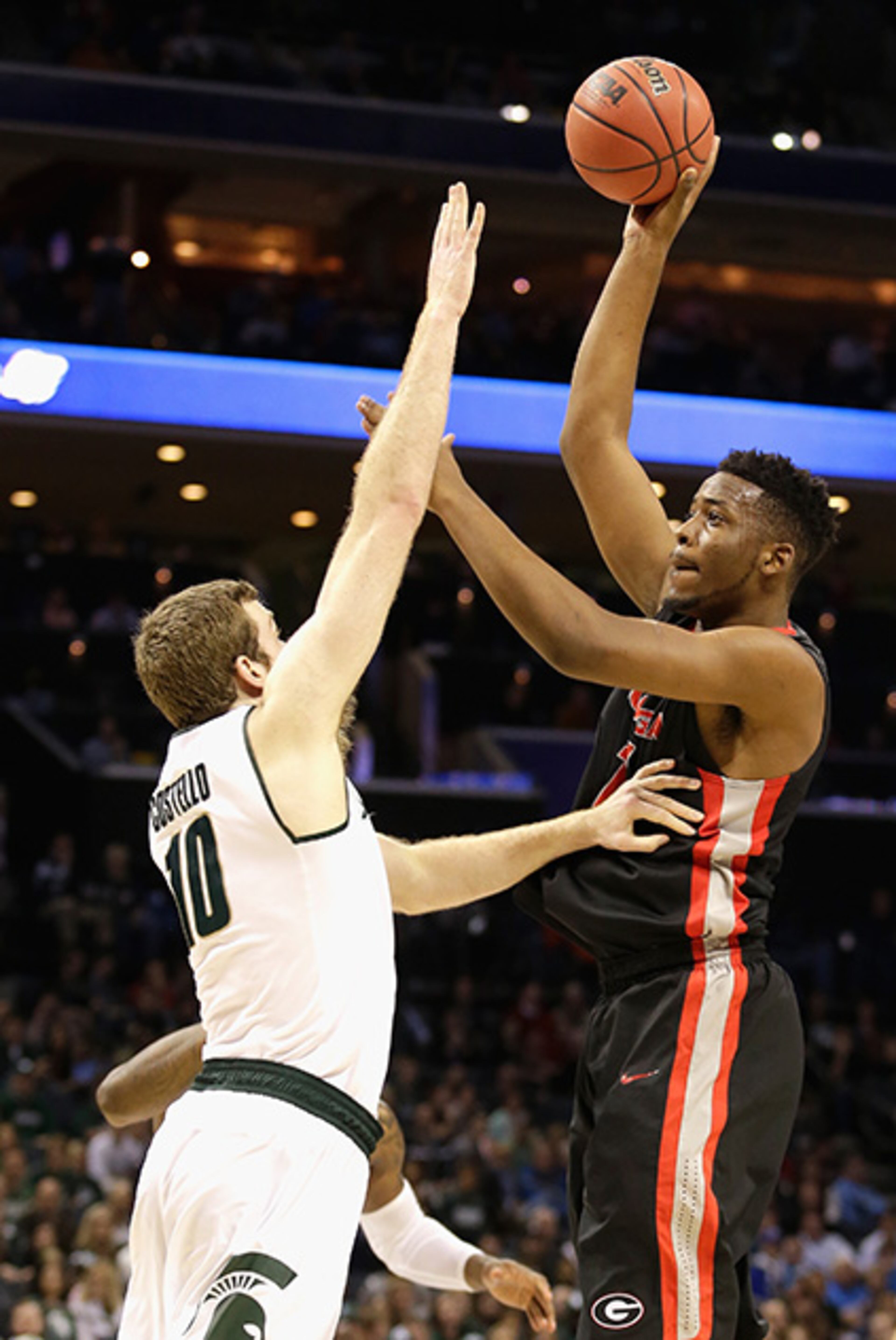 Matt Costello of the Michigan State Spartans tries to stop Yante Maten of the Georgia Bulldogs during the second round of the 2015 NCAA Men's Basketball Tournament at Time Warner Cable Arena on March 20, 2015 in Charlotte, N.C.