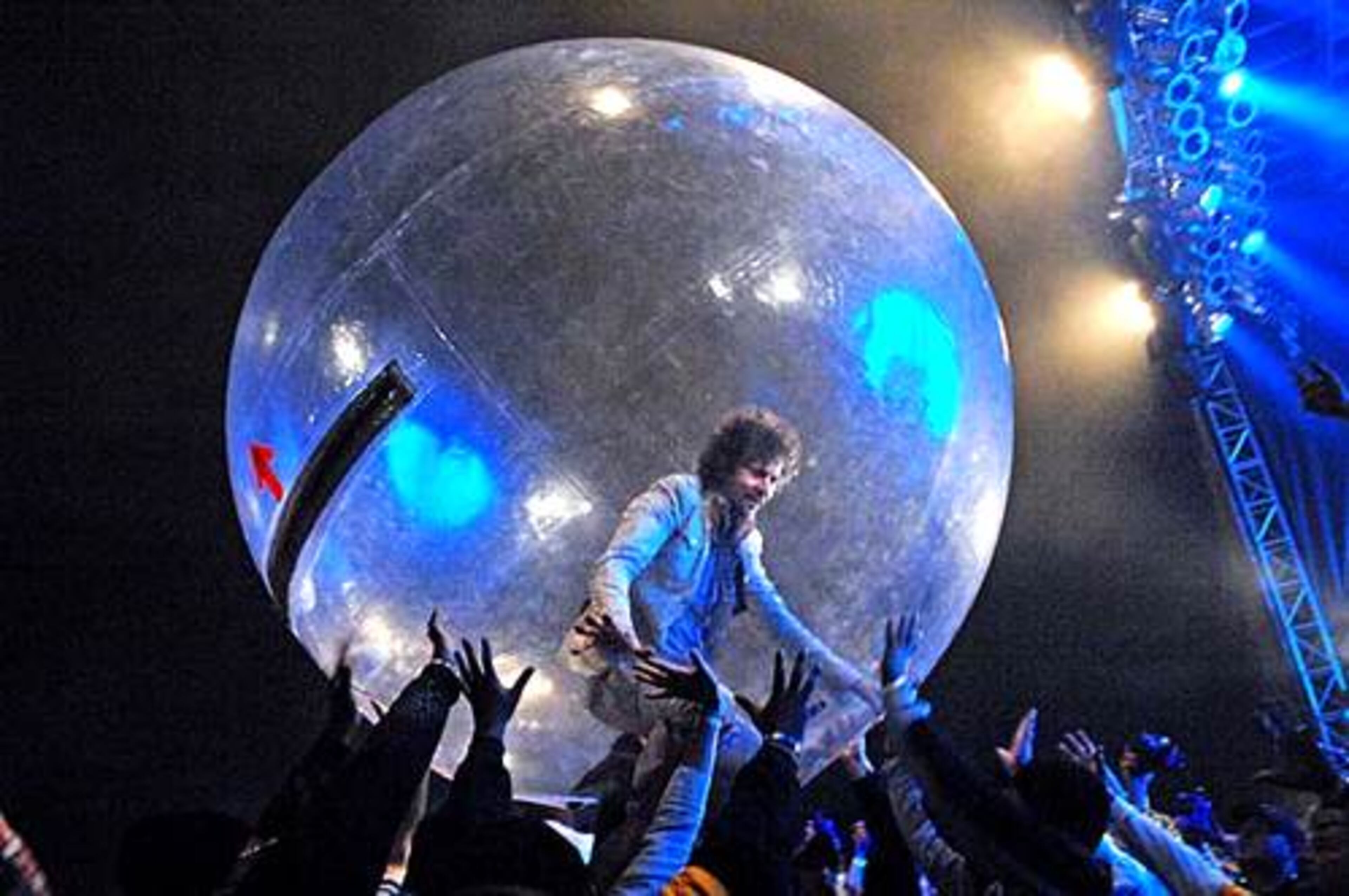 Wayne Coyne, frontman for the Flaming Lips, rolls over the crowd inside a plastic bubble. The Flaming Lips were the headline act for Friday night. The band is known for its elaborate shows.
