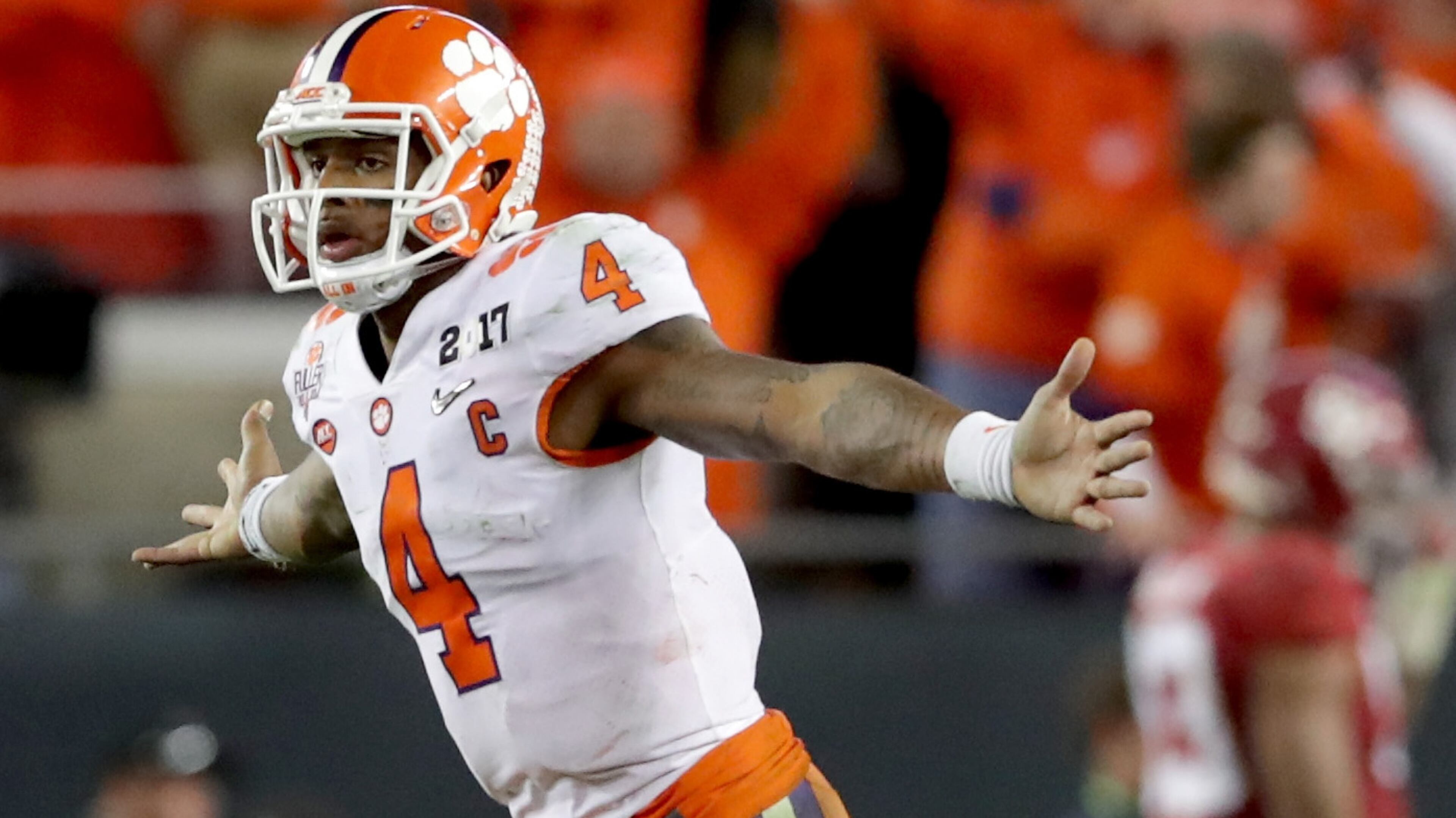 TAMPA, FL - JANUARY 09: Quarterback Deshaun Watson #4 of the Clemson Tigers celebrates after throwing a 2-yard game-winning touchdown pass during the fourth quarter against the Alabama Crimson Tide to win the 2017 College Football Playoff National Championship Game 35-31 at Raymond James Stadium on January 9, 2017 in Tampa, Florida. (Photo by Streeter Lecka/Getty Images)