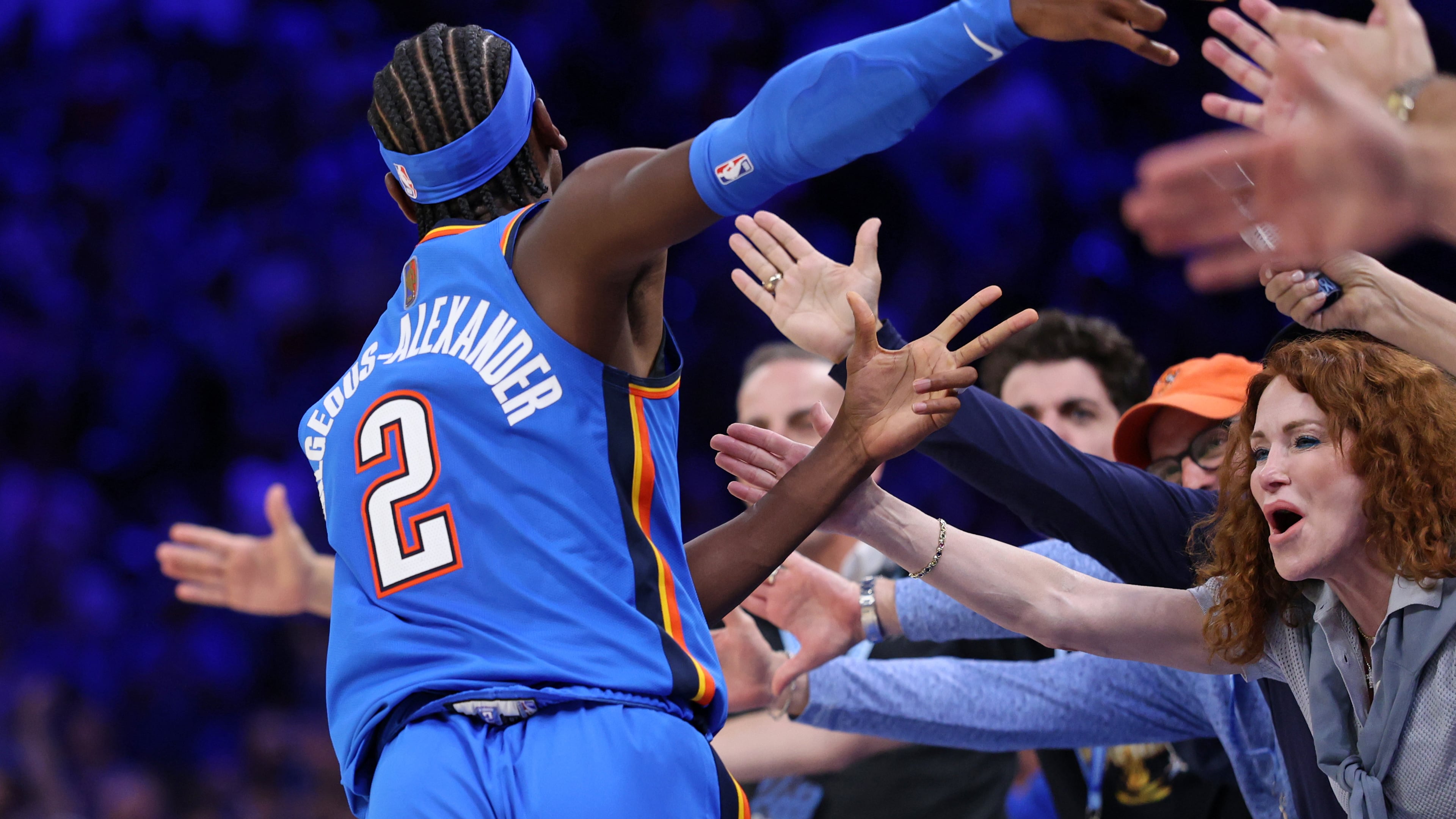 Oklahoma City Thunder guard Shai Gilgeous-Alexander celebrates with fans after making a basket during the second half of an NBA basketball game against the Denver Nuggets, Thursday, Oct. 22, 2026, in Oklahoma City. (AP Photo/Nate Billings)