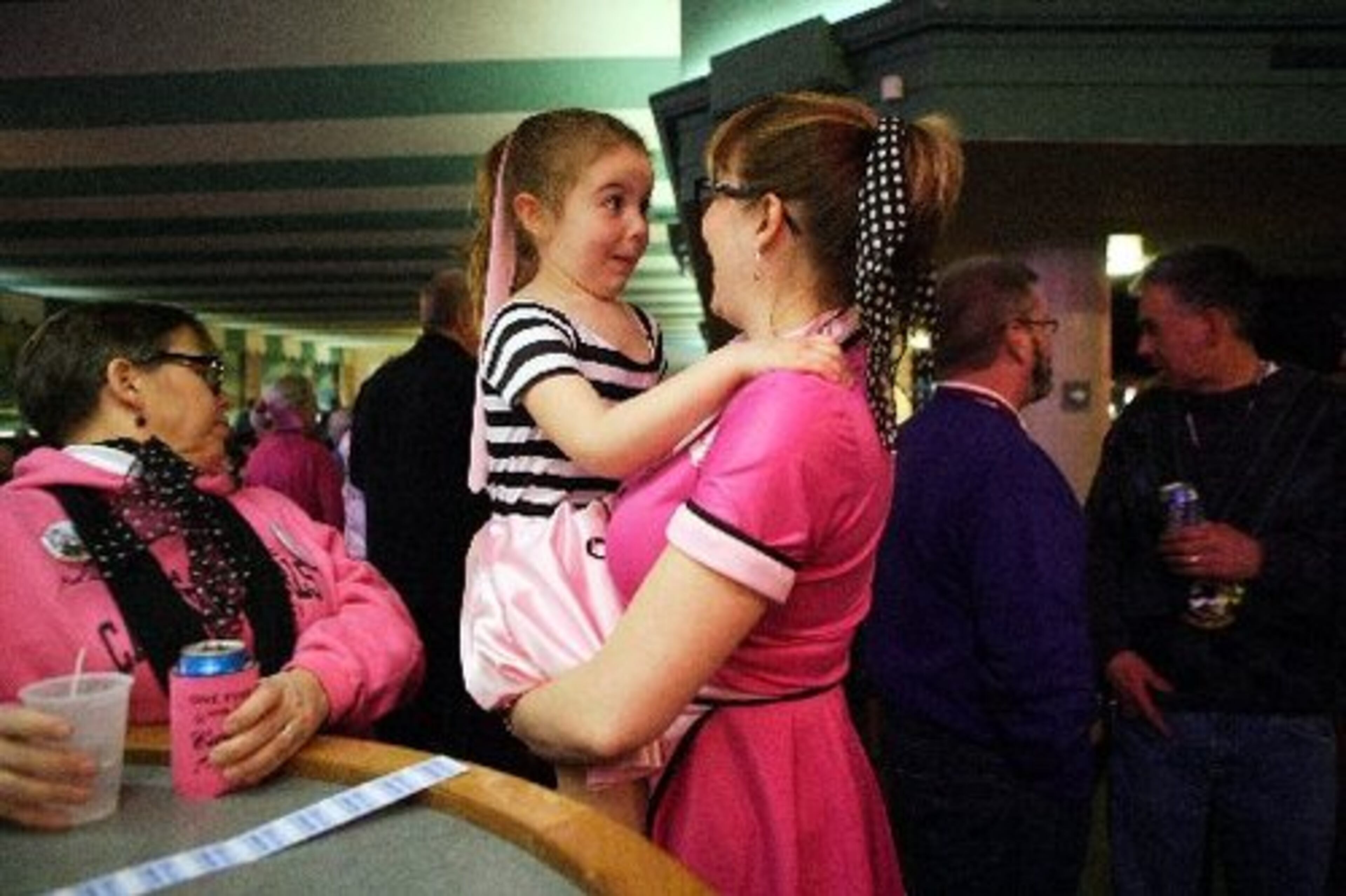 Shannon Teeling asks her daughter, Brynn Teeling, 5, if she wants a malt at the Winter Dance Party.