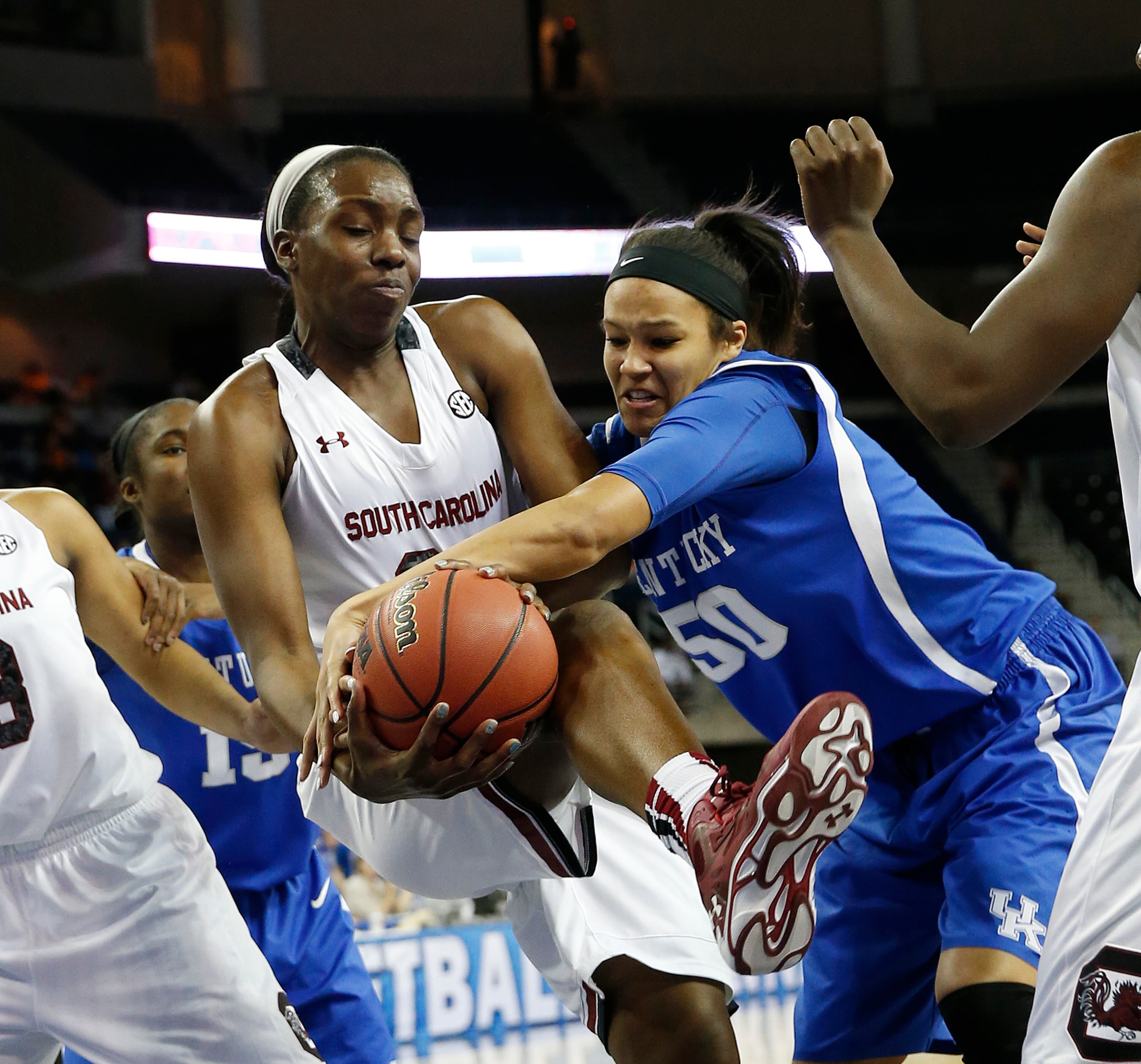 South Carolina center Elem Ibiam (33) and Kentucky forward/center Azia Bishop (50) battle for a rebound in the first half an NCAA college basketball game in the semifinals of the Southeastern Conference women's basketball tournament Saturday, March 8, 2014, in Duluth, Ga.